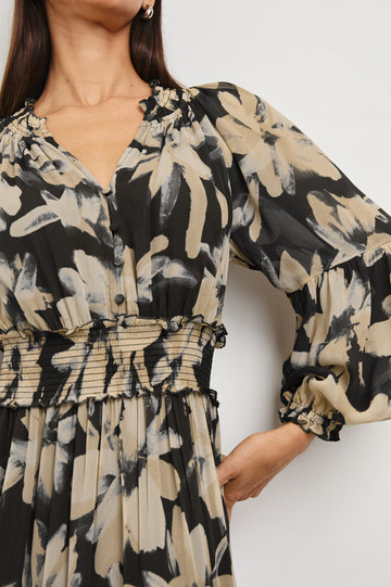 Frederica long sleeve flowy maxi dress with smocked neckline and waist and tiered skirt in Charcoal Lily - close up of details on model