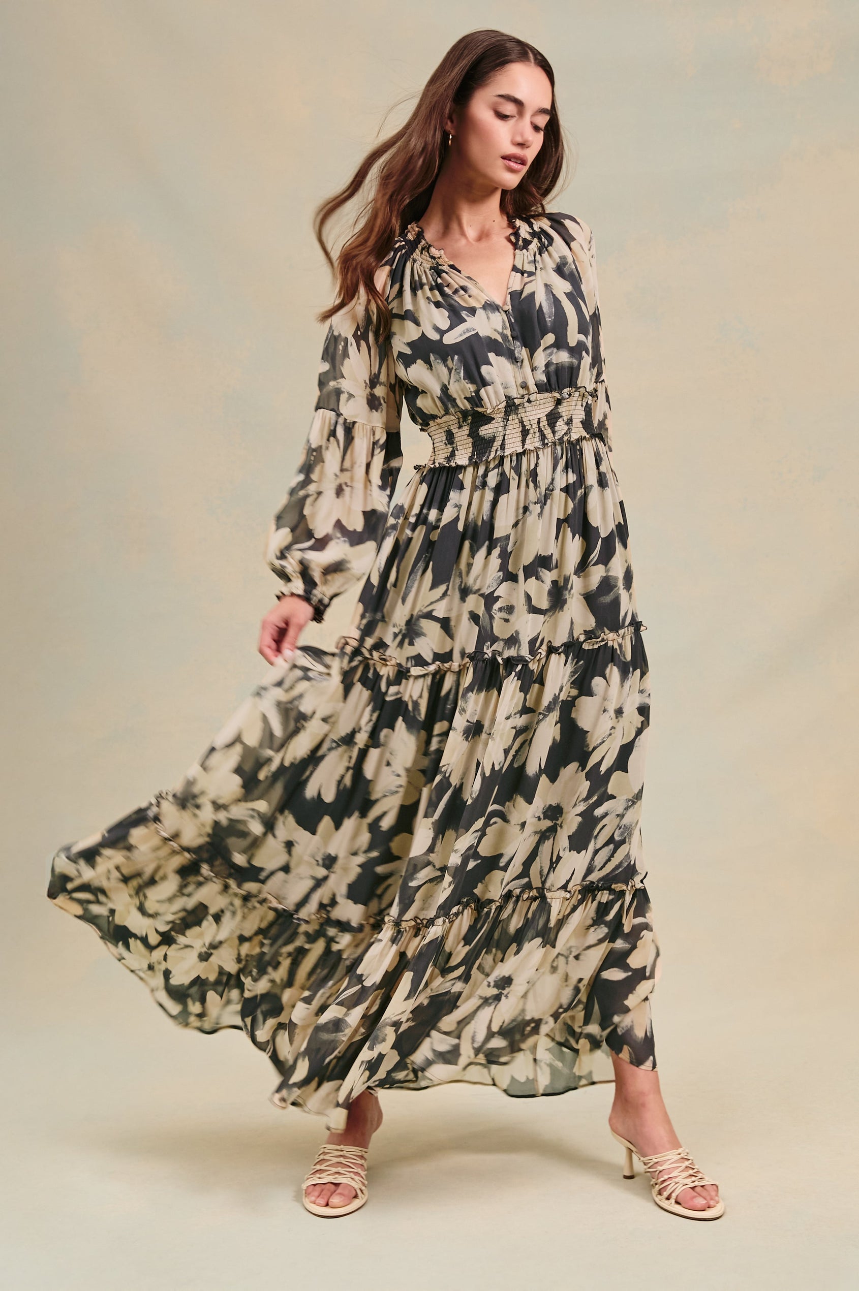 Frederica long sleeve flowy maxi dress with smocked neckline and waist and tiered skirt in Charcoal Lily - stylized front view on model