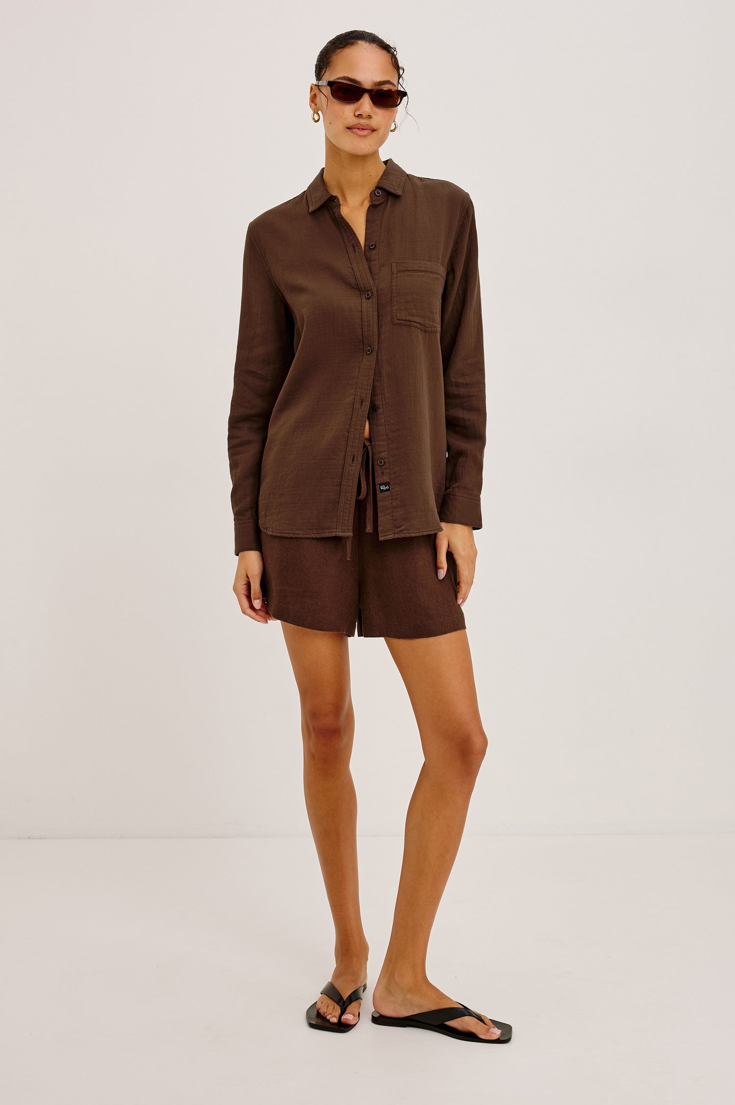 Freeman Button-Up Shirt With Collar, Subtle Herringbone Texture, Relaxed FIt, Chest Patch Pockets, and Long Sleeves in Espresso Colorway - Full Body Front View Featured on Model
