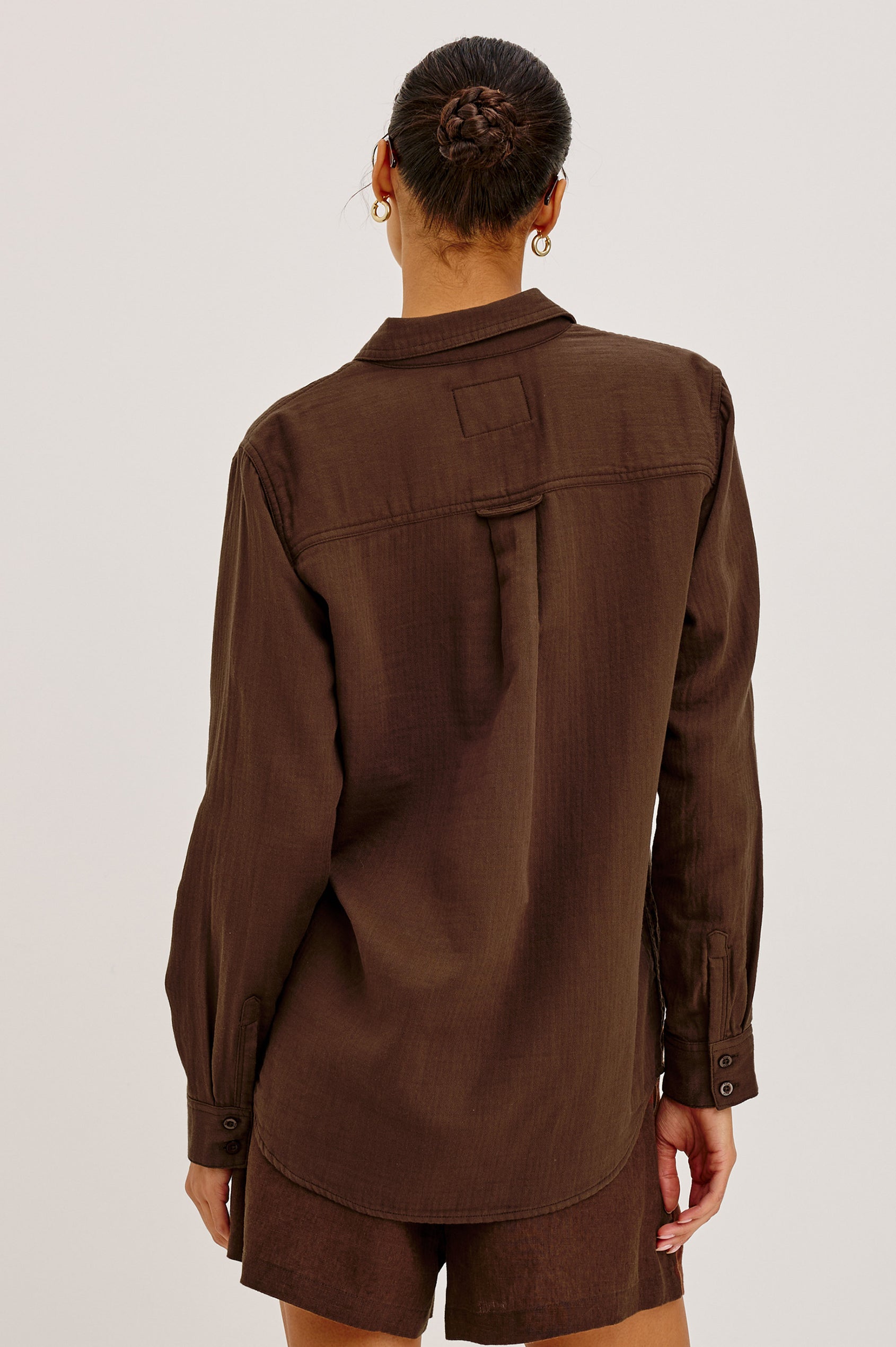 Freeman Button-Up Shirt With Collar, Subtle Herringbone Texture, Relaxed FIt, Chest Patch Pockets, and Long Sleeves in Espresso Colorway - Upper Body Back View Featured on Model