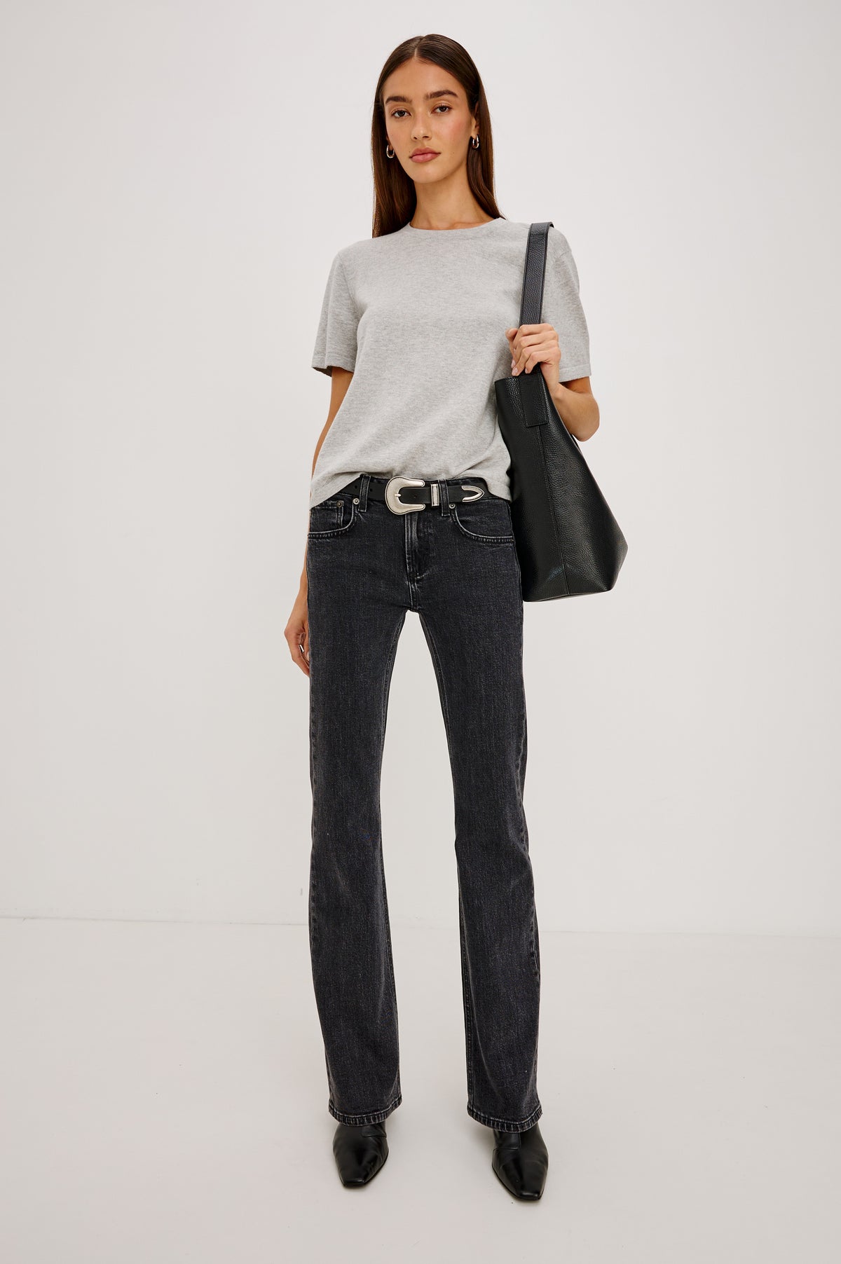 Fremont Low Rise Bootcut Jean in Light Stretch Denim With Extended Inseam, 5-Pockets, Belt Loops, and Zip-Fly Closure in Blackjack Colorway - Lower Body Front View Featured on Model