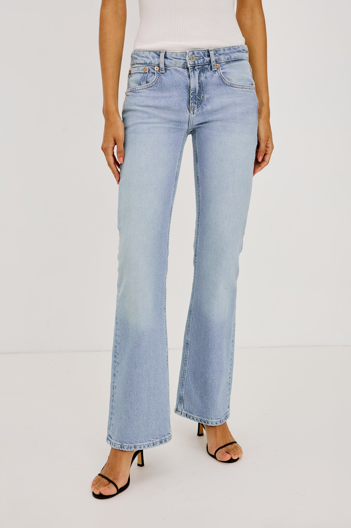 Fremont Low Rise Bootcut Jean in Light Stretch Denim With Extended Inseam, 5-Pockets, Belt Loops, and Zip-Fly Closure in Jasper Colorway - Lower Body Front View Featured on Model