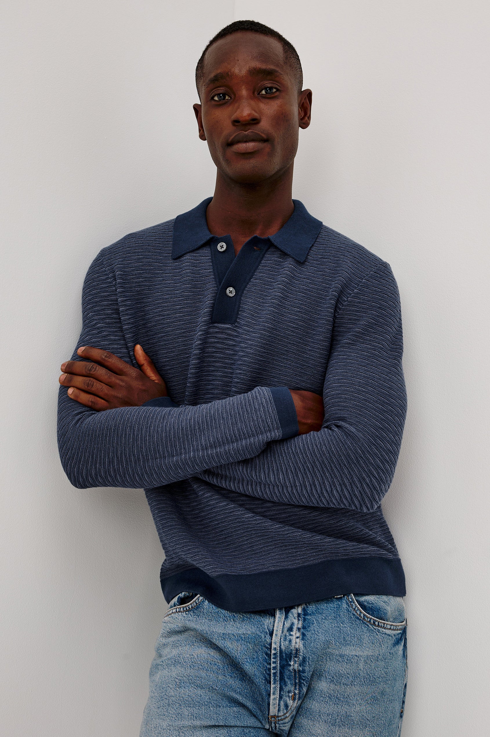 Fulton Sweater in Lightweight Cotton Knit With Raglan Long Sleeves, Two-Button Placket, Collar, and Tonal Texture in Navy Wave Colorway - Upper Body Front View Featured on Model