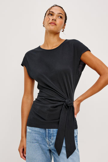 Gabbie Top in Cotton With Boat Neckline Dolman Cap Sleeves and Waist Wrap Ties in Black Colorway - Upper Body Front View Featured on Model