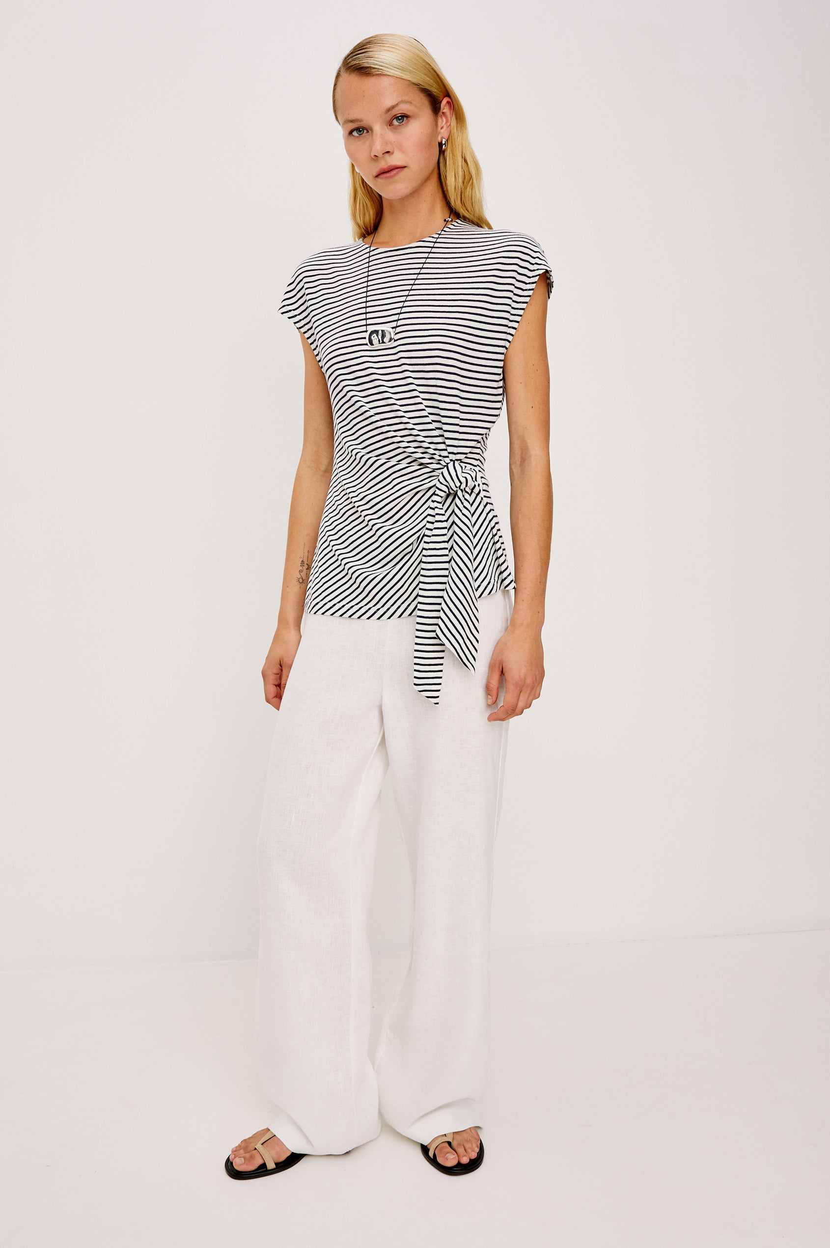 Gabbie Top in Cotton With Boat Neckline Dolman Cap Sleeves and Waist Wrap Ties in Ivory Navy Micro Stripe Colorway - Upper Body Front View Featured on Model
