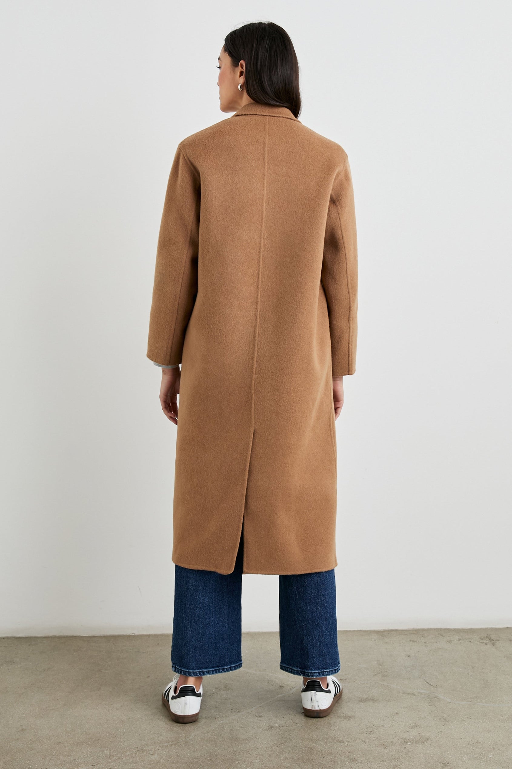 Gallery Below-the-Knee Coat with Three-Button Closure, Notched Lapels, and Two Front Flap Pockets in Camel Colorway - Back Full Body View Featured on Model