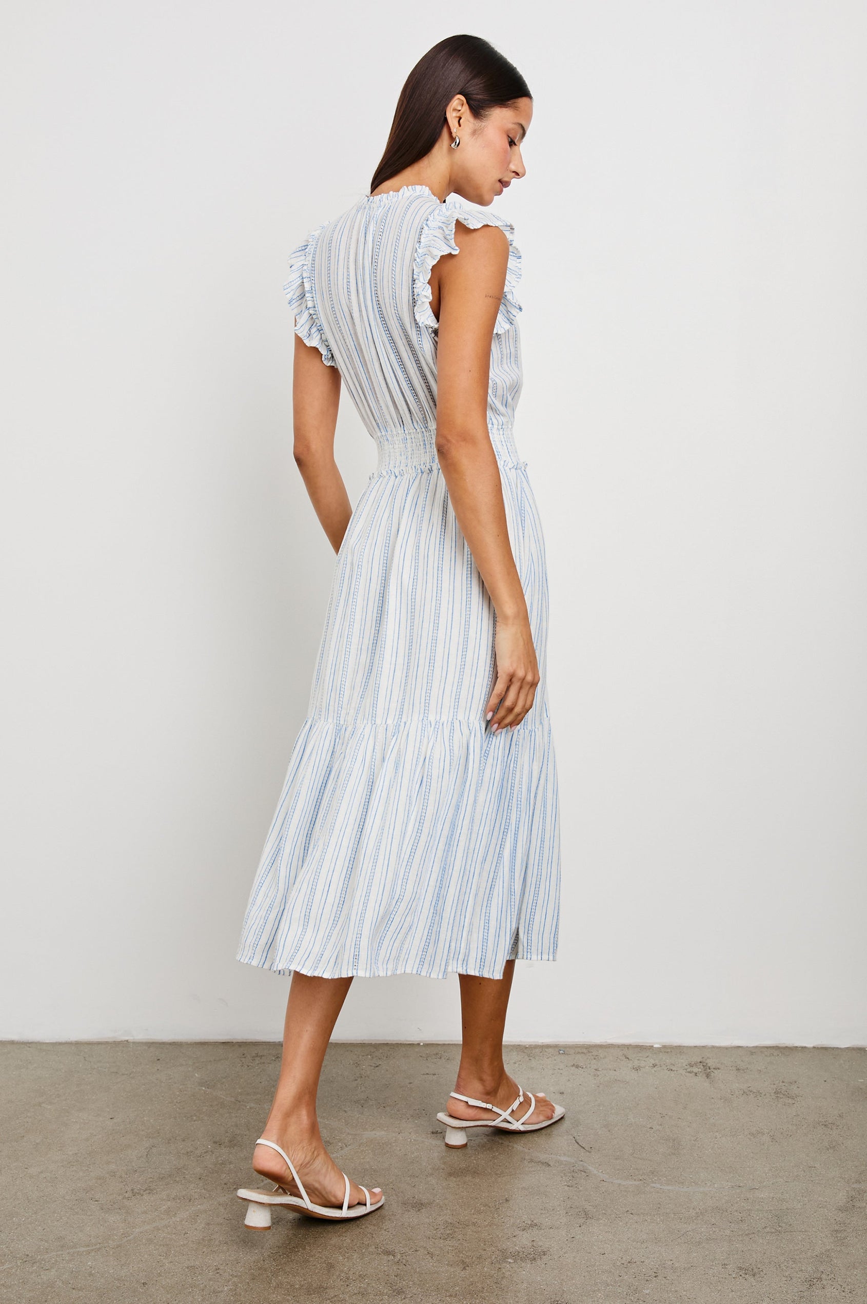 Garden Midi Dress with Flutter Cap Sleeves, Drawstrings at V-Neck and Shirred Waistband in Sonoma Stripe Colorway, Thin Vertical Blue Stripes on White - Back Full Body View Featured on Model