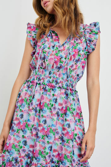 Garden Midi Dress with Flutter Cap Sleeves, Drawstrings at Neck and Shirred Waistband in Spring Meadow Colorway, Flowers in Pinks, Blues and Green - Front View Featured on Model