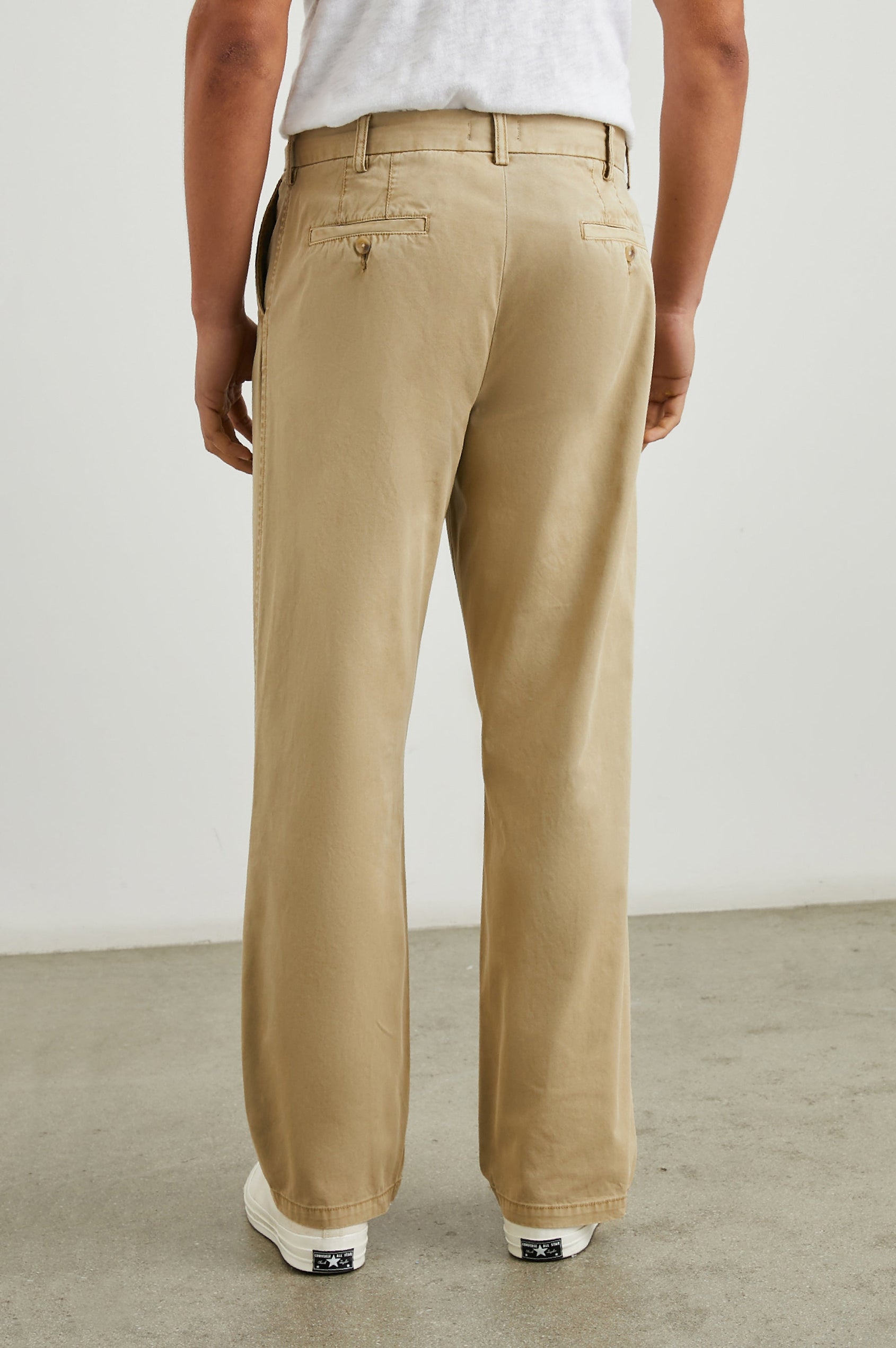 Garrett Pants with a Button Strap Closure at the Waist, Belt Loops, Two Front Pockets and Two Back Button Welt Pockets in True Khaki Colorway - Back View Featured on Model