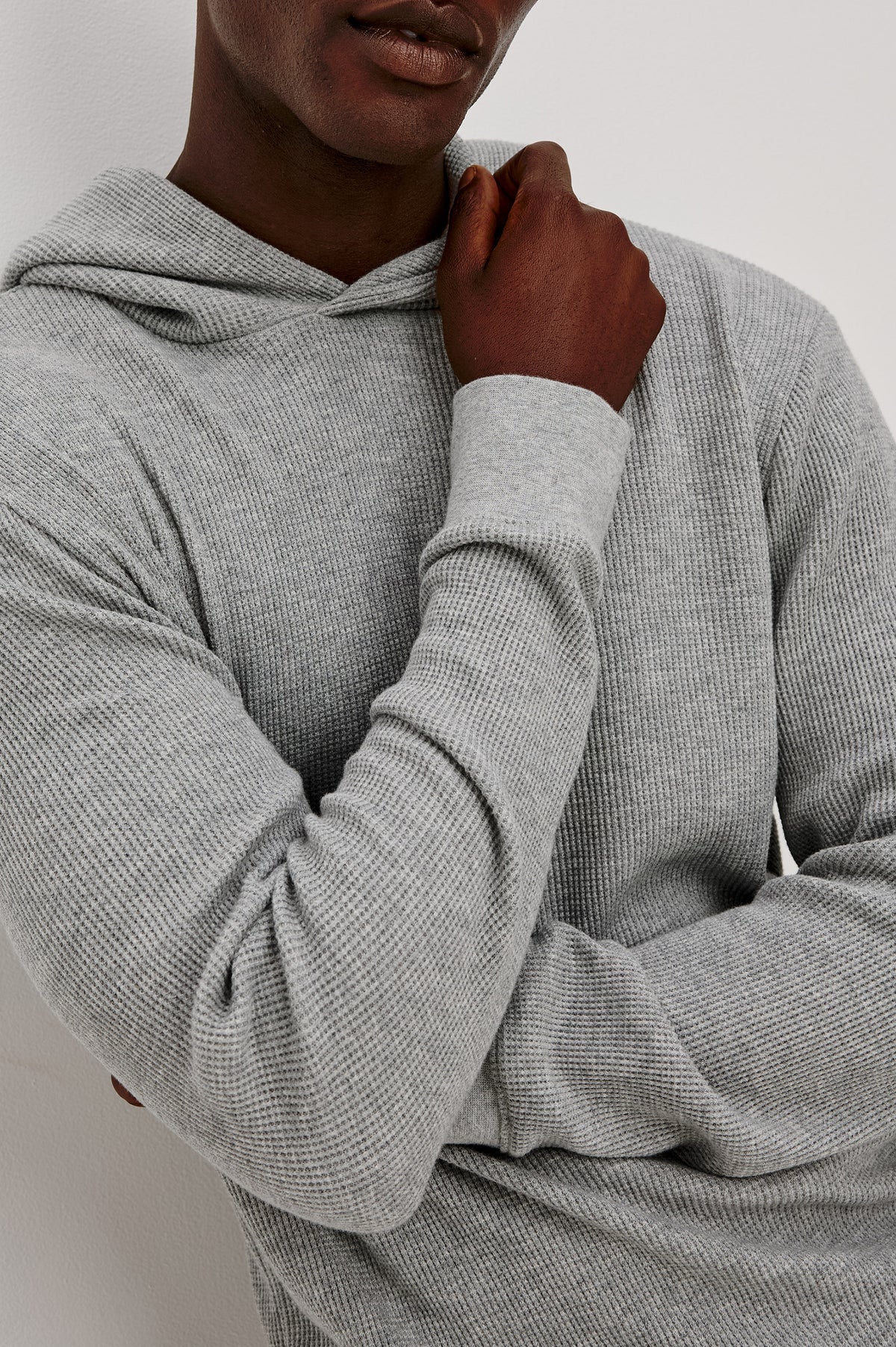 Gates Hoodie in Micro-Waffle Cotton Blend With Fixed Hood, Long Sleeves, and Relaxed Fit in Heather Grey Colorway - Upper Body Front View Featured on Model