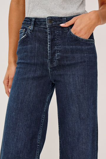 Getty Wide Leg Jean in Light Stretch Denim With High-Rise High-Waisted Fit, Button Fly, and 5-Pockets in After Midnight Colorway - Lower Body Front View Featured on Model