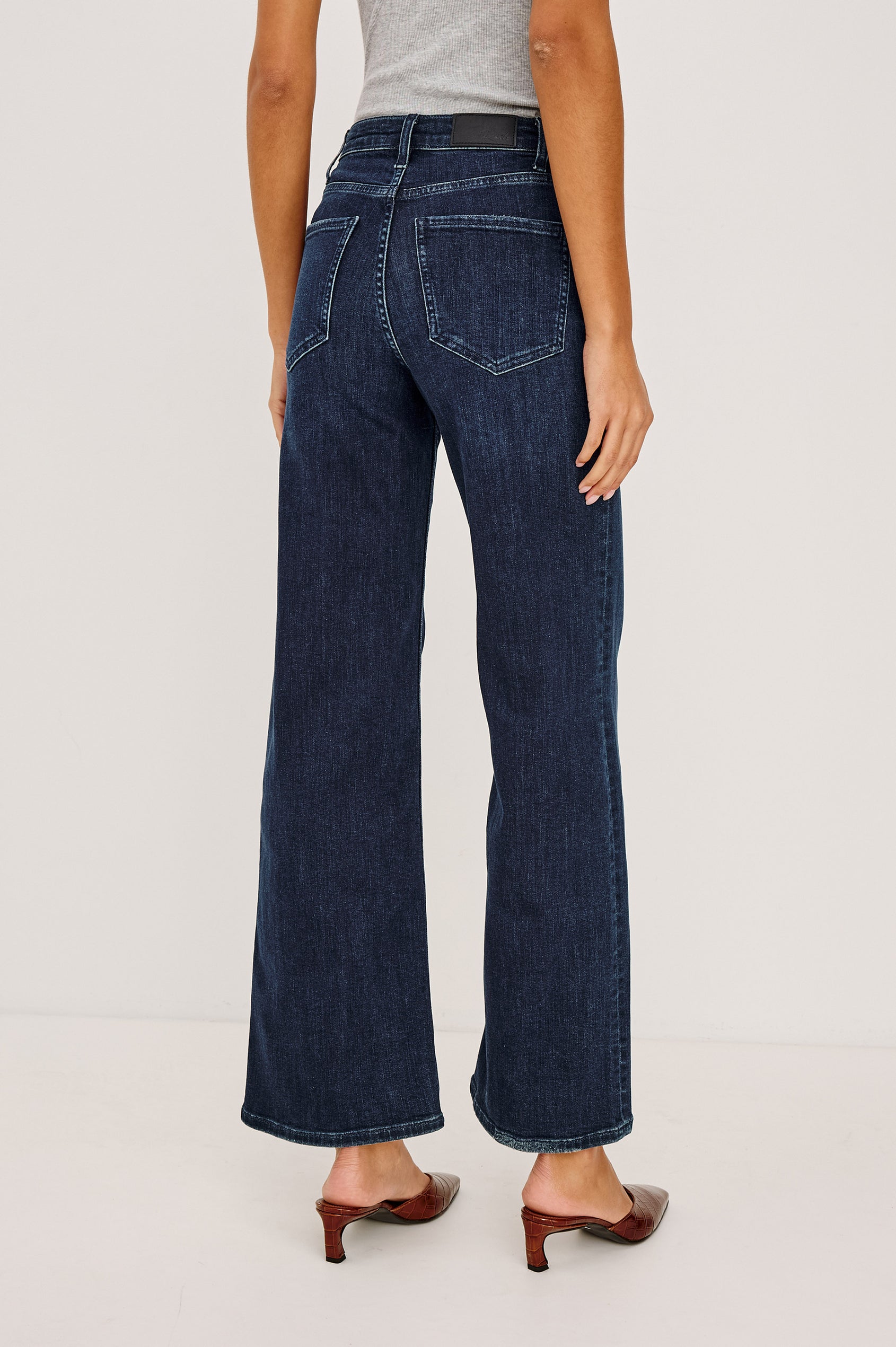 Getty Wide Leg Jean in Light Stretch Denim With High-Rise High-Waisted Fit, Button Fly, and 5-Pockets in After Midnight Colorway - Lower Body Back View Featured on Model