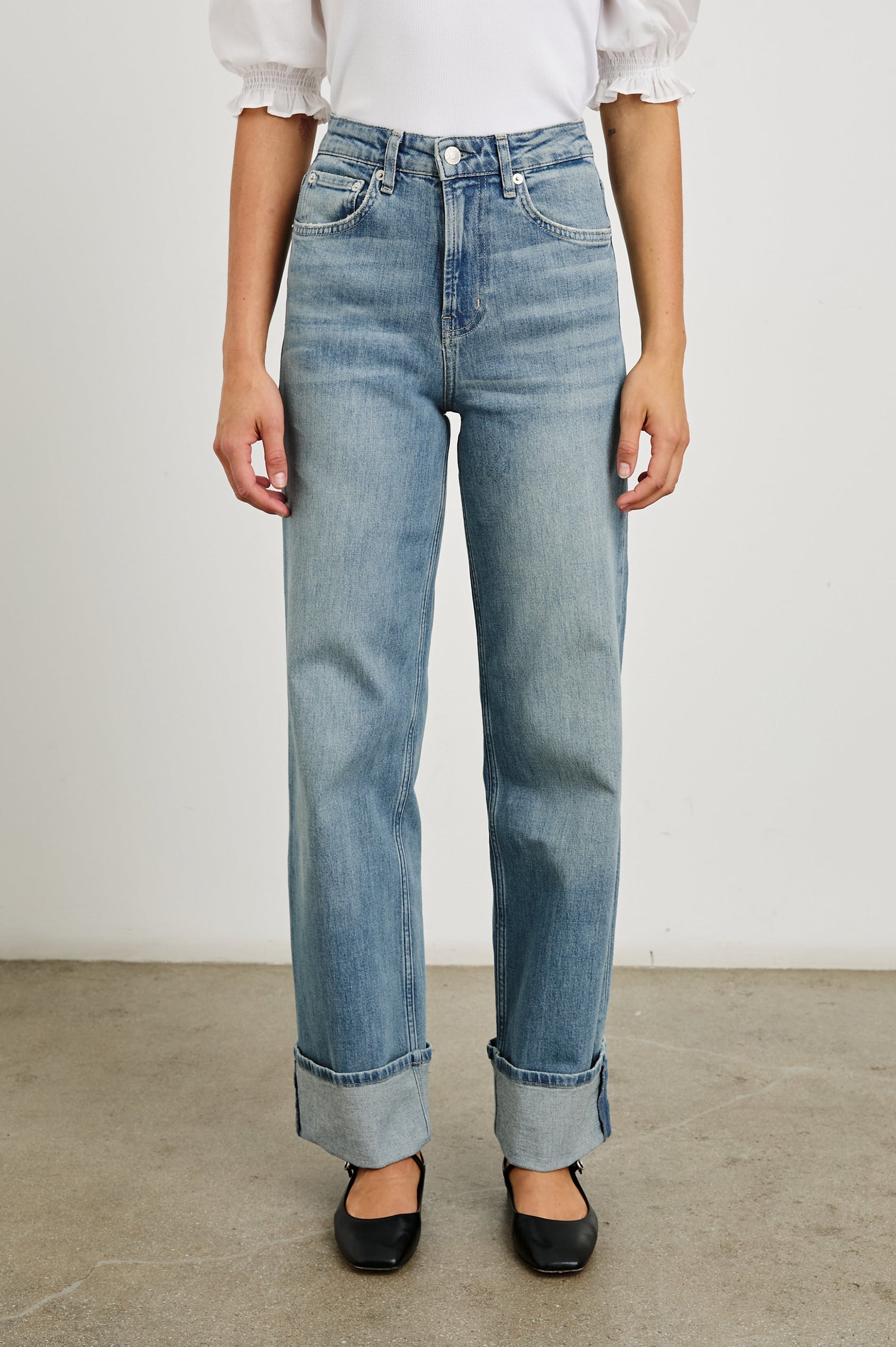 Getty Wide Leg Denim Pants with Cuffed Hems, Belt Loops, Two Front Pockets and Two Back Patch Pockets in Baltic Sea Cuffed Colorway - Front View Featured on Model
