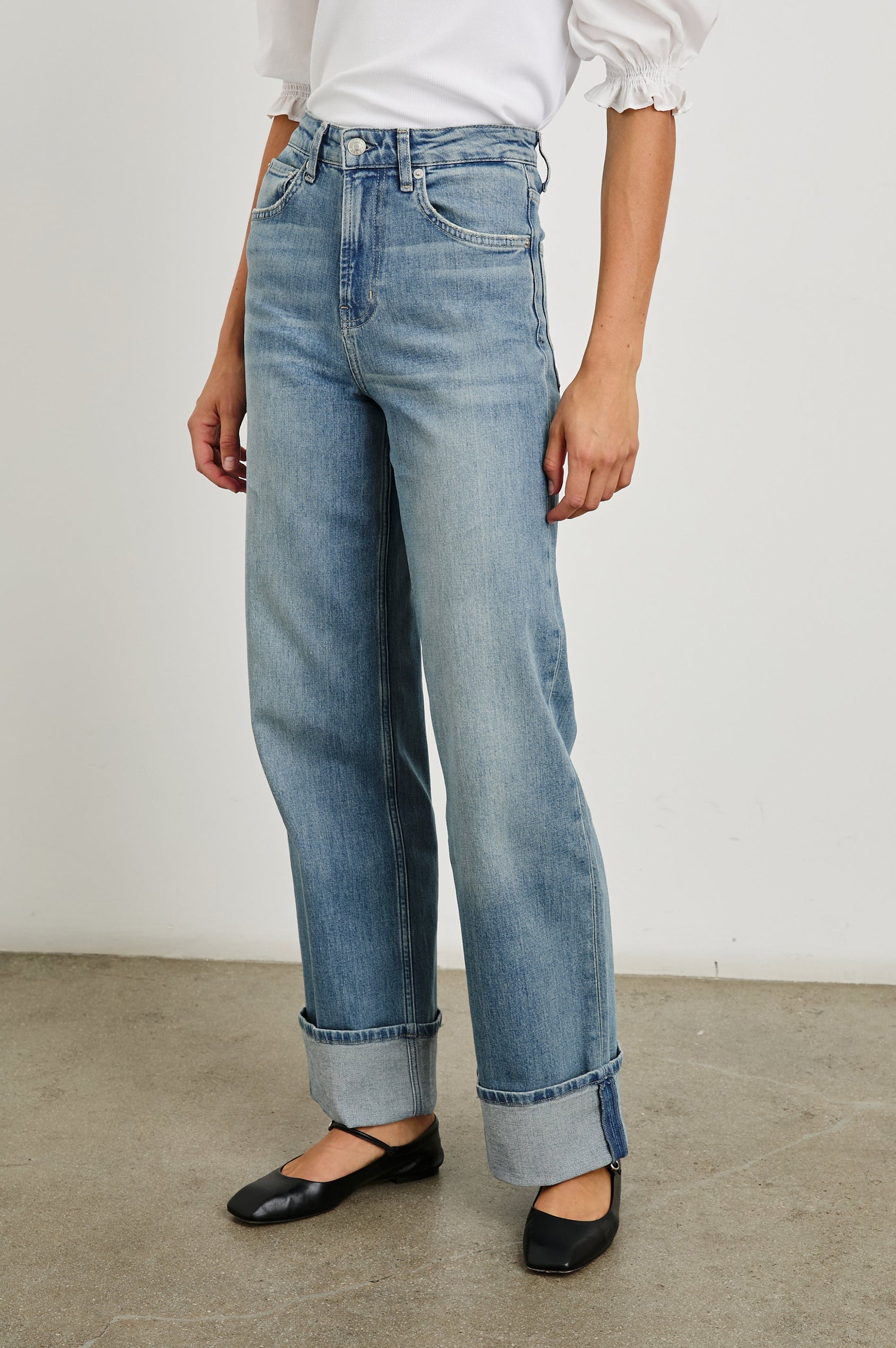 Getty Wide Leg Denim Pants with Cuffed Hems, Belt Loops, Two Front Pockets and Two Back Patch Pockets in Baltic Sea Cuffed Colorway - Front View Featured on Model