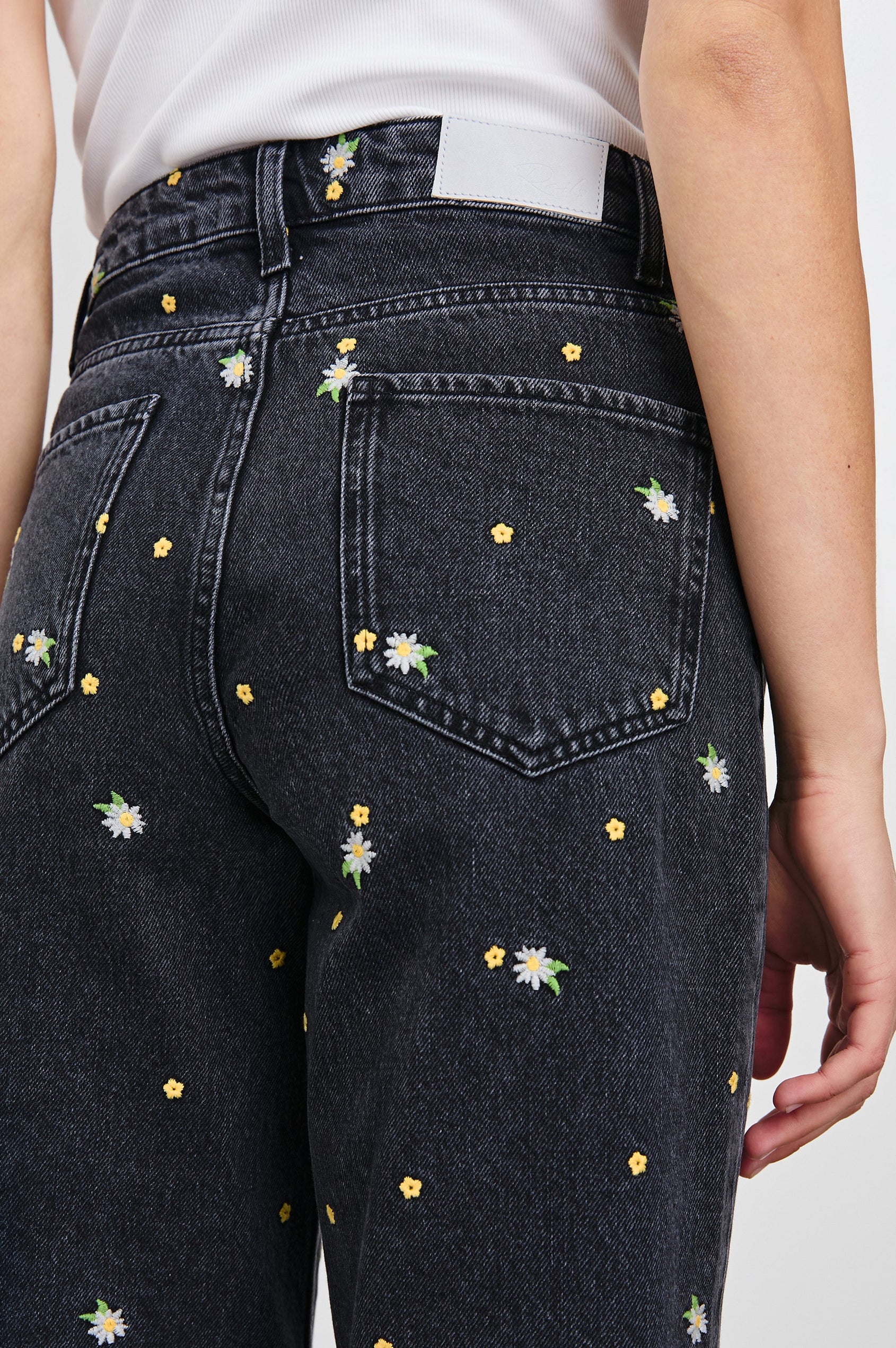 Getty Crop Wide Leg Denim Pants with Belt Loops, Two Front Pockets and Two Back Patch Pockets in Ash Black Floral Colorway, with yellow and purple flowers on Ash - Back View Featured on Model