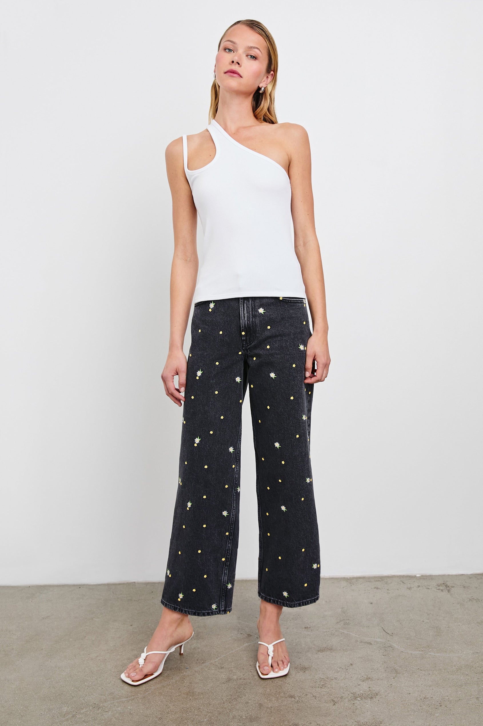 Getty Crop Wide Leg Denim Pants with Belt Loops, Two Front Pockets and Two Back Patch Pockets in Ash Black Floral Colorway, with yellow and purple flowers on Ash - Front Full Body View Featured on Model