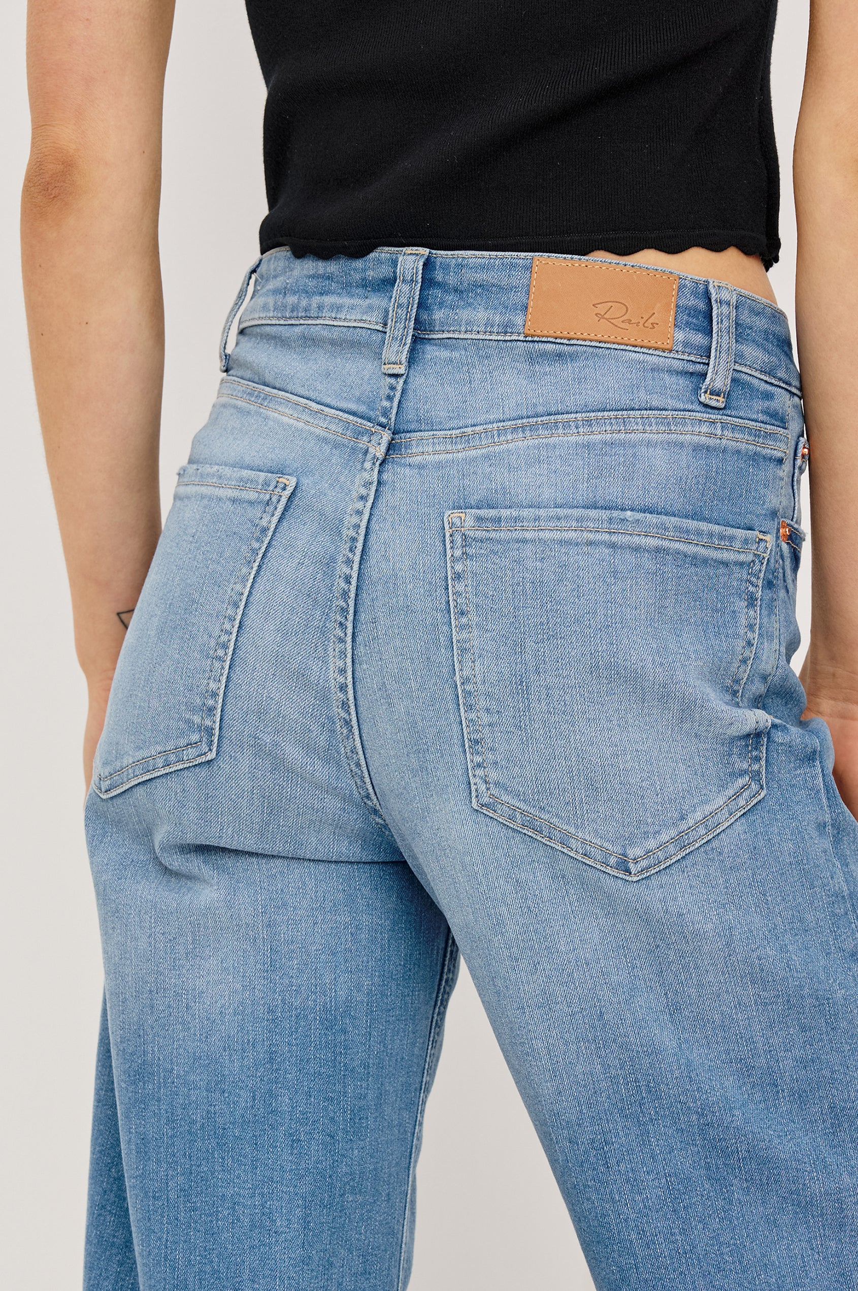 Getty Crop Jean in Light Stretch Denim With Wide Straight Legs, 27″ Inseam, Floral Embroidery, 5-Pockets, and Zip Fly in Independence Colorway - Lower Body Close Up Back View Featured on Model