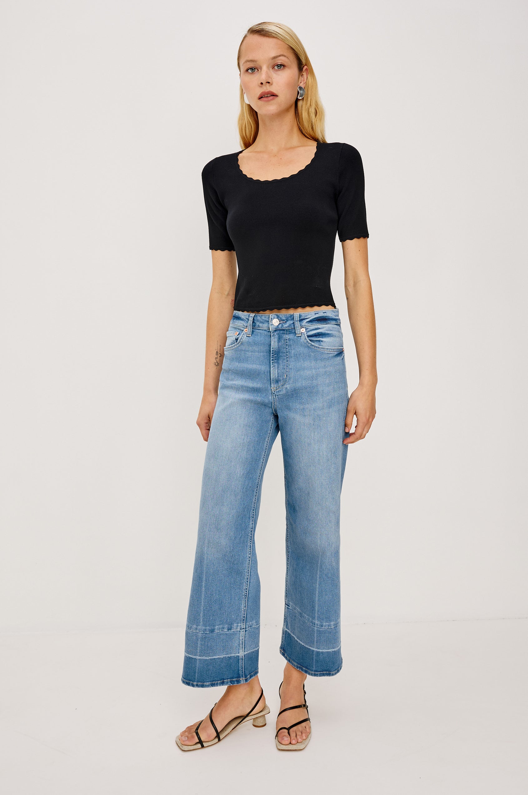 Getty crop isa a 5-pkt wide leg jean in Independence colorway, a medium wash with a released hem - full body front view featured on model.