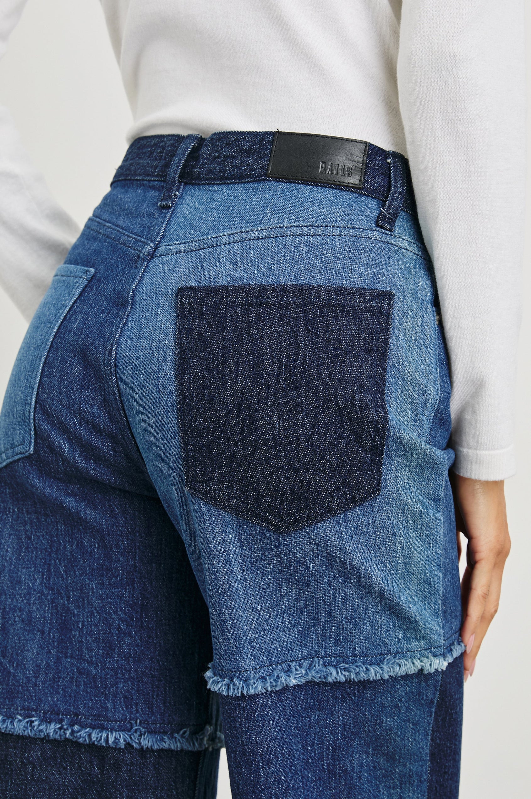 Getty Crop Wide Leg Denim Pants with Belt Loops, Two Front Pockets and Two Back Patch Pockets in Indigo Patchwork Colorway, with large patches in blues - Front View Featured on Model