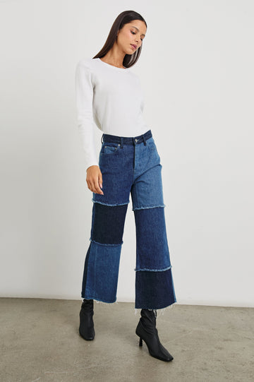 Getty Crop Wide Leg Denim Pants with Belt Loops, Two Front Pockets and Two Back Patch Pockets in Indigo Patchwork Colorway, with large patches in blues - Front Full Body View Featured on Model
