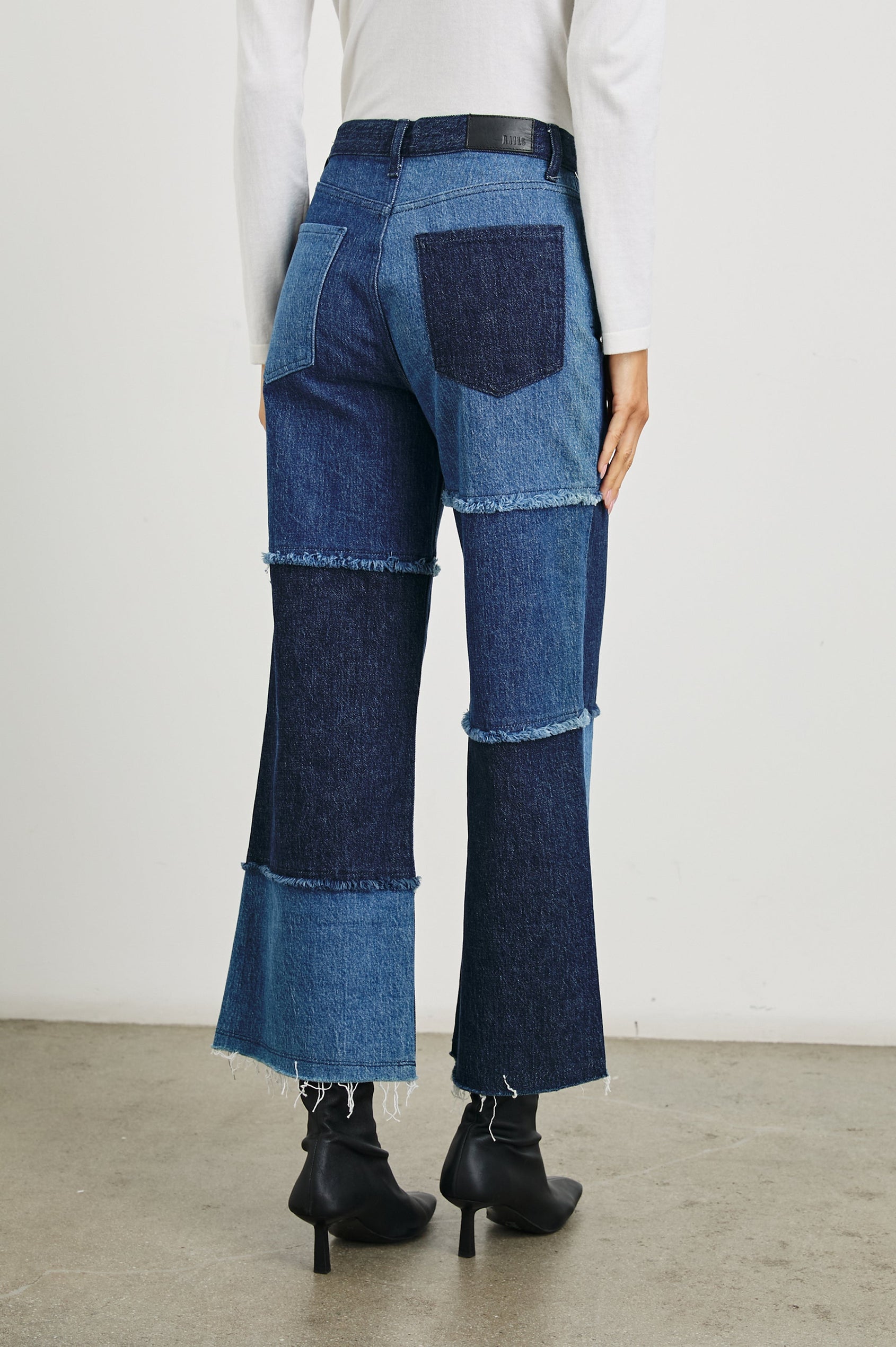Getty Crop Wide Leg Denim Pants with Belt Loops, Two Front Pockets and Two Back Patch Pockets in Indigo Patchwork Colorway, with large patches in blues - Back View Featured on Model
