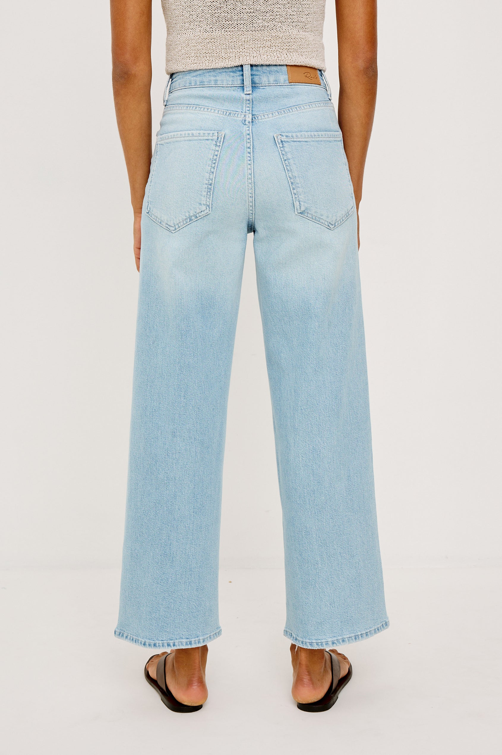 Getty Crop Jean in Light Stretch Denim With Wide Straight Legs, 27″ Inseam, 5-Pockets, and Zip Fly in Leilani Embroidered Colorway - Lower Body Back View Featured on Model
