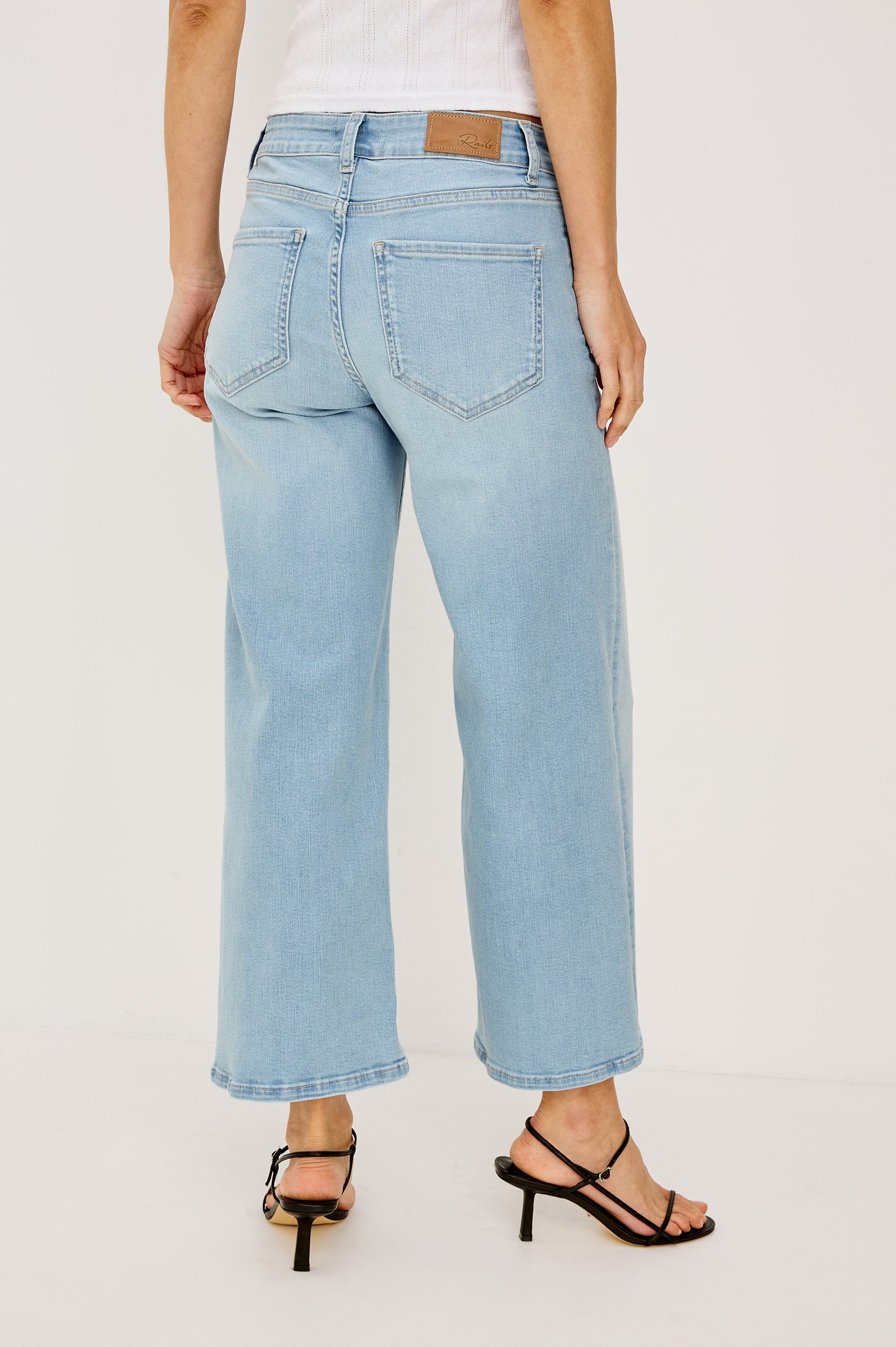 Getty Wide Leg Crop Jean in Light Stretch Denim With Wide Straight Legs, 27″ Inseam, 5-Pockets, and Front Button Fly in Low Rise Seaport Colorway - Lower Body Back View Featured on Model