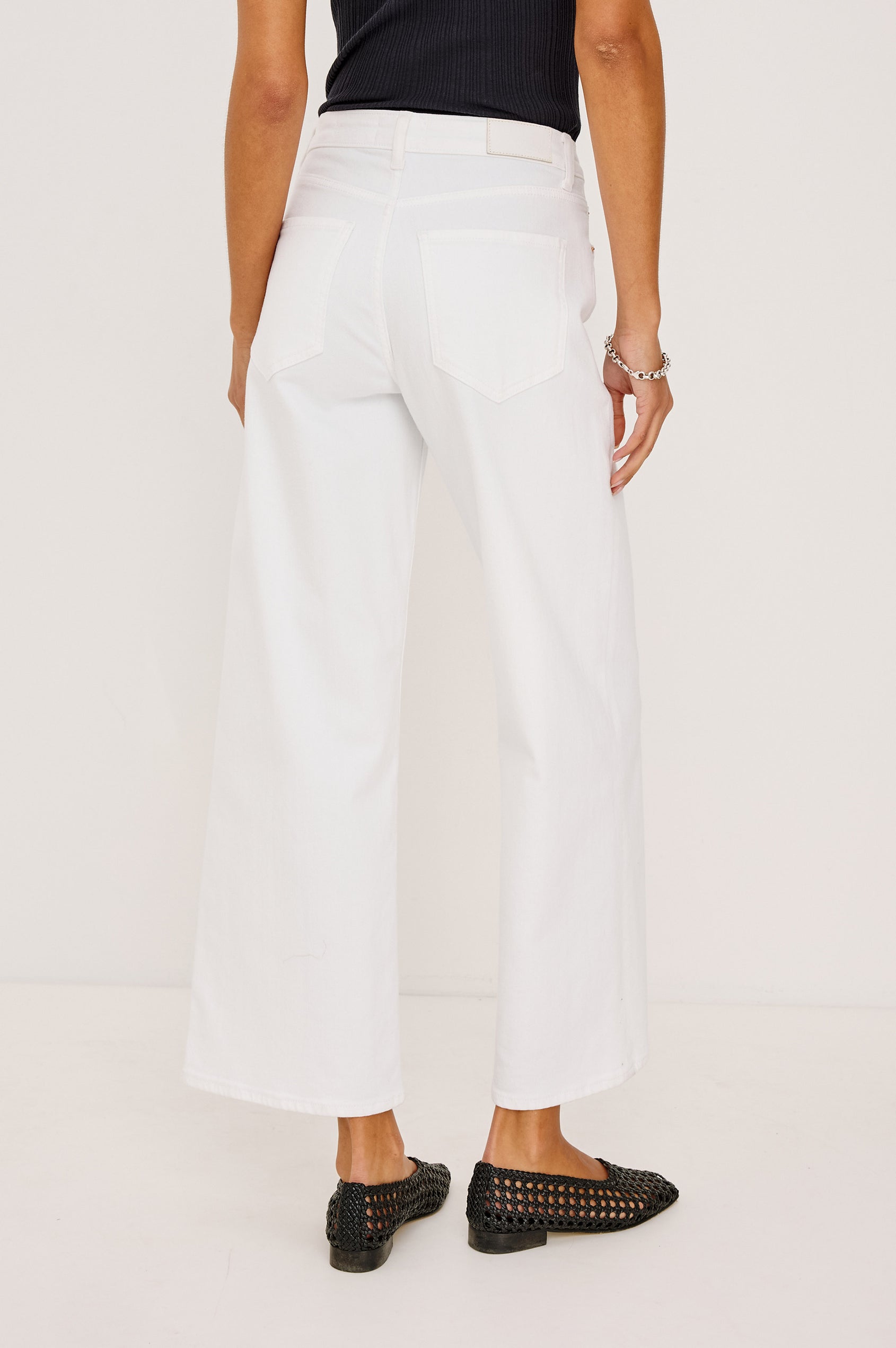 Getty Crop Jean in Light Stretch Denim With Wide Straight Legs, 27″ Inseam, 5-Pockets, and Zip Fly in Salt White Colorway - Lower Body Back View Featured on Model