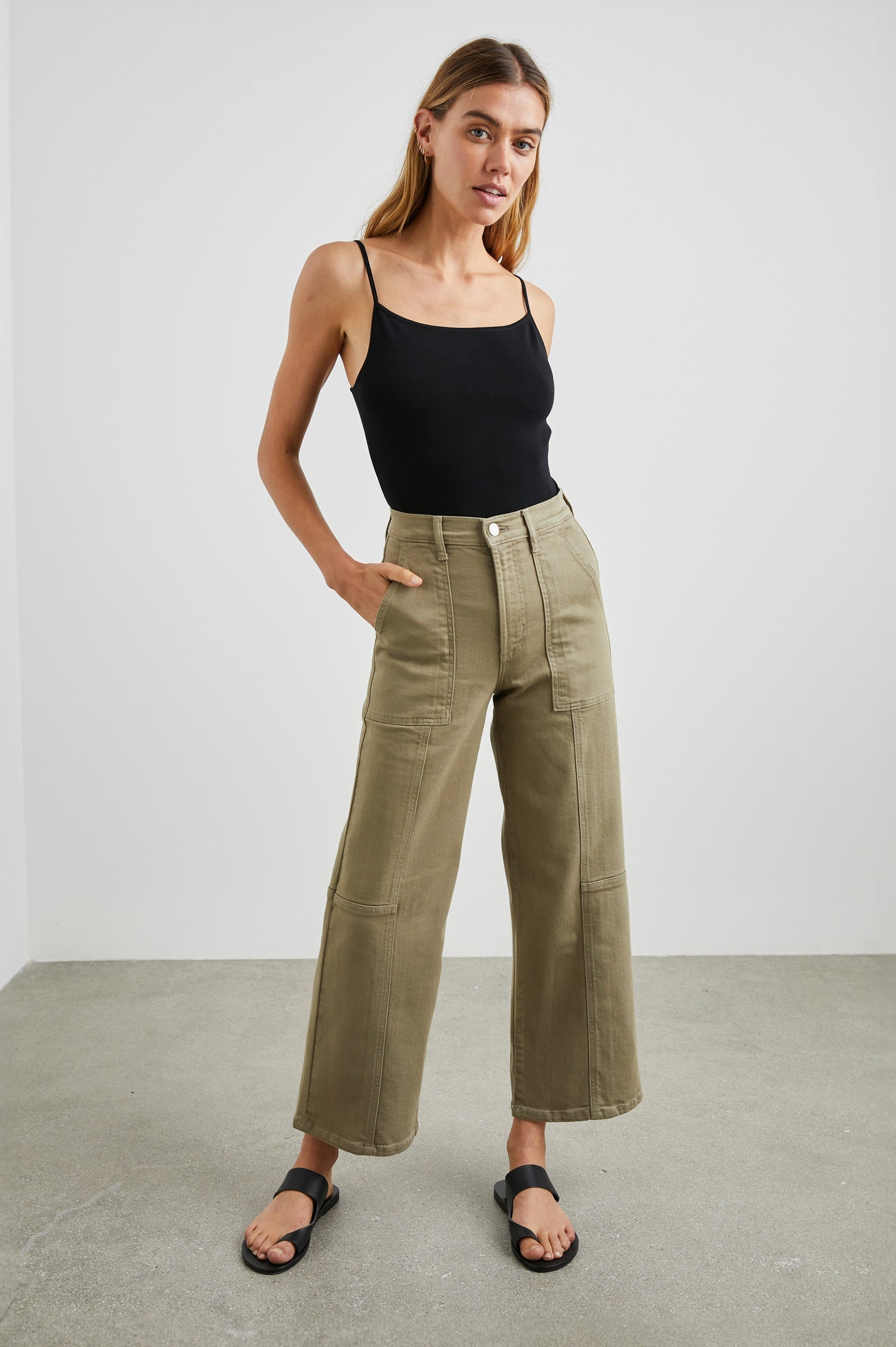 Getty Crop Utility Wide Leg Denim Pants with Belt Loops, Additional Seams, Two large Front Pockets and Two Back Patch Pockets in Washed Olive Colorway - Front Full Body View Featured on Model