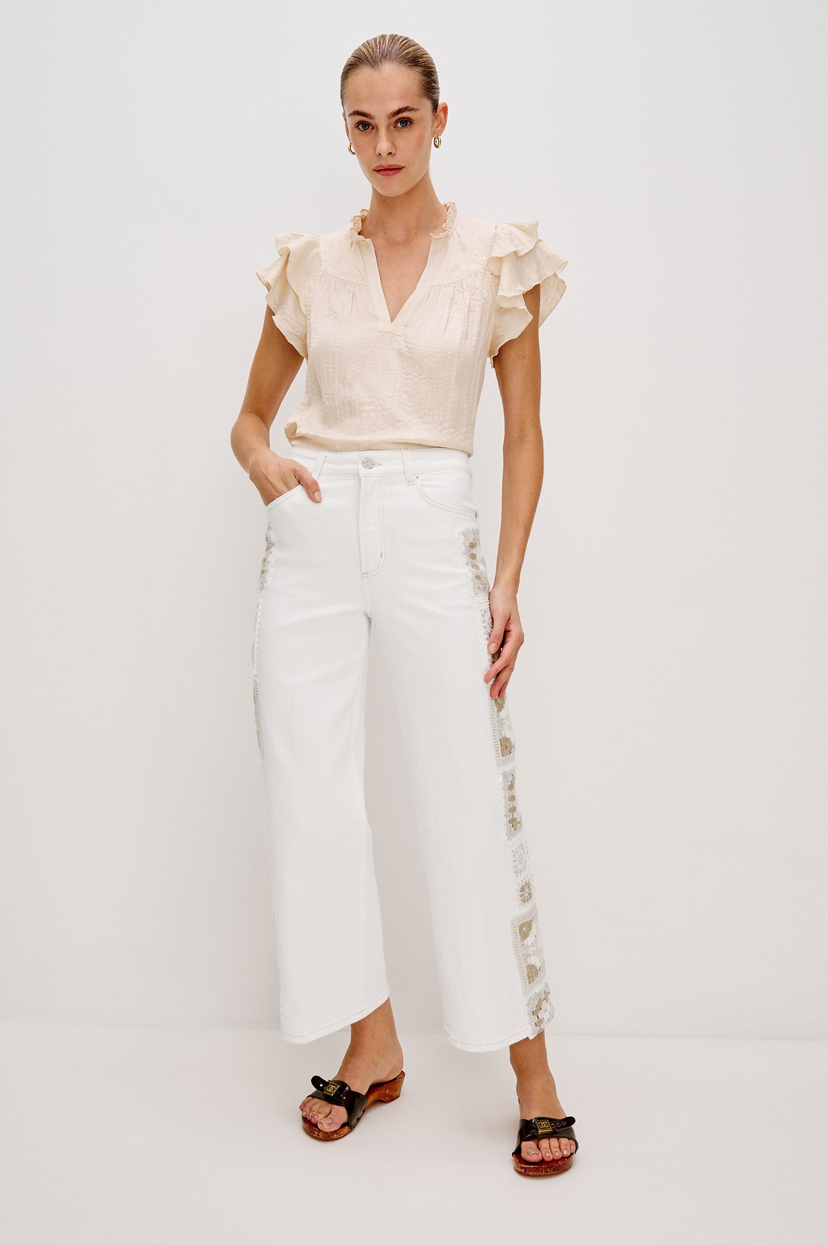 Getty Crop 5-Pocket Denim Pant with Tonal Crochet Side Seam Panels, Traditional Zip and Button Fly and Belt Loops in Vintage Ecru Crochet Colorway. Full Body Front View Shown on Model.