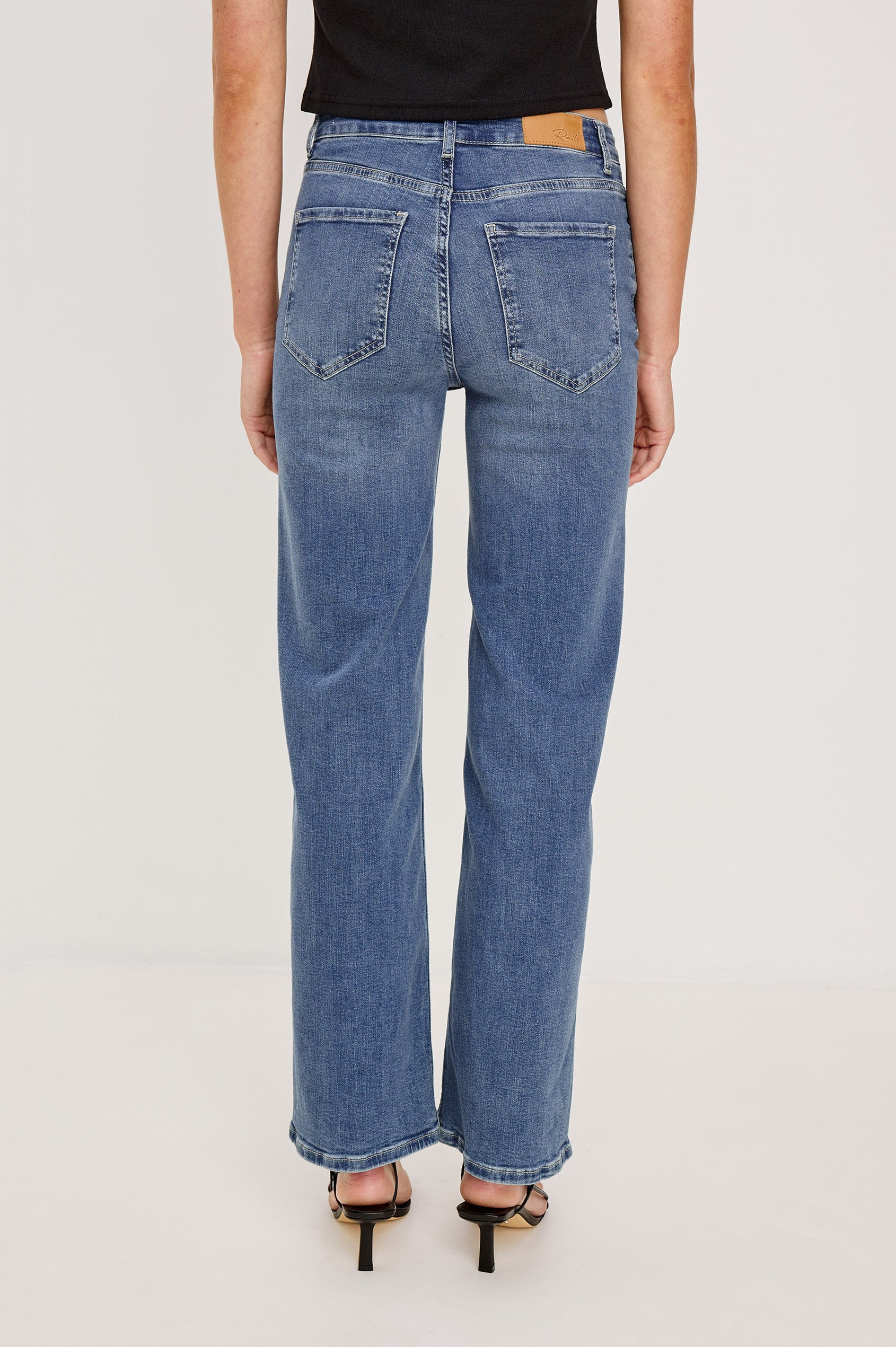 Getty Wide Leg Denim Pants with Belt Loops, Two Front Pockets and Two Back Patch Pockets in East Coast Colorway - Back View Featured on Model