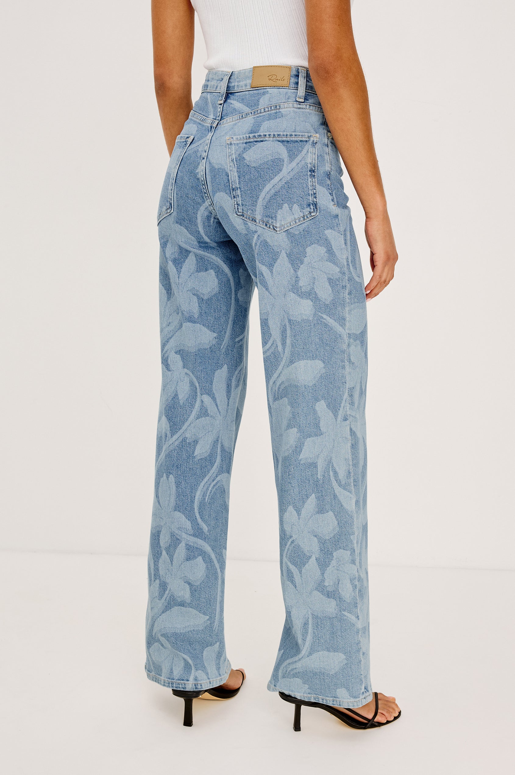 Getty Wide Leg Jean in Light Stretch Denim With High-Rise High-Waisted Fit, Button Fly, and 5-Pocket Styling in Floral Laser Colorway - Lower Body FrBacknt View Featured on Model