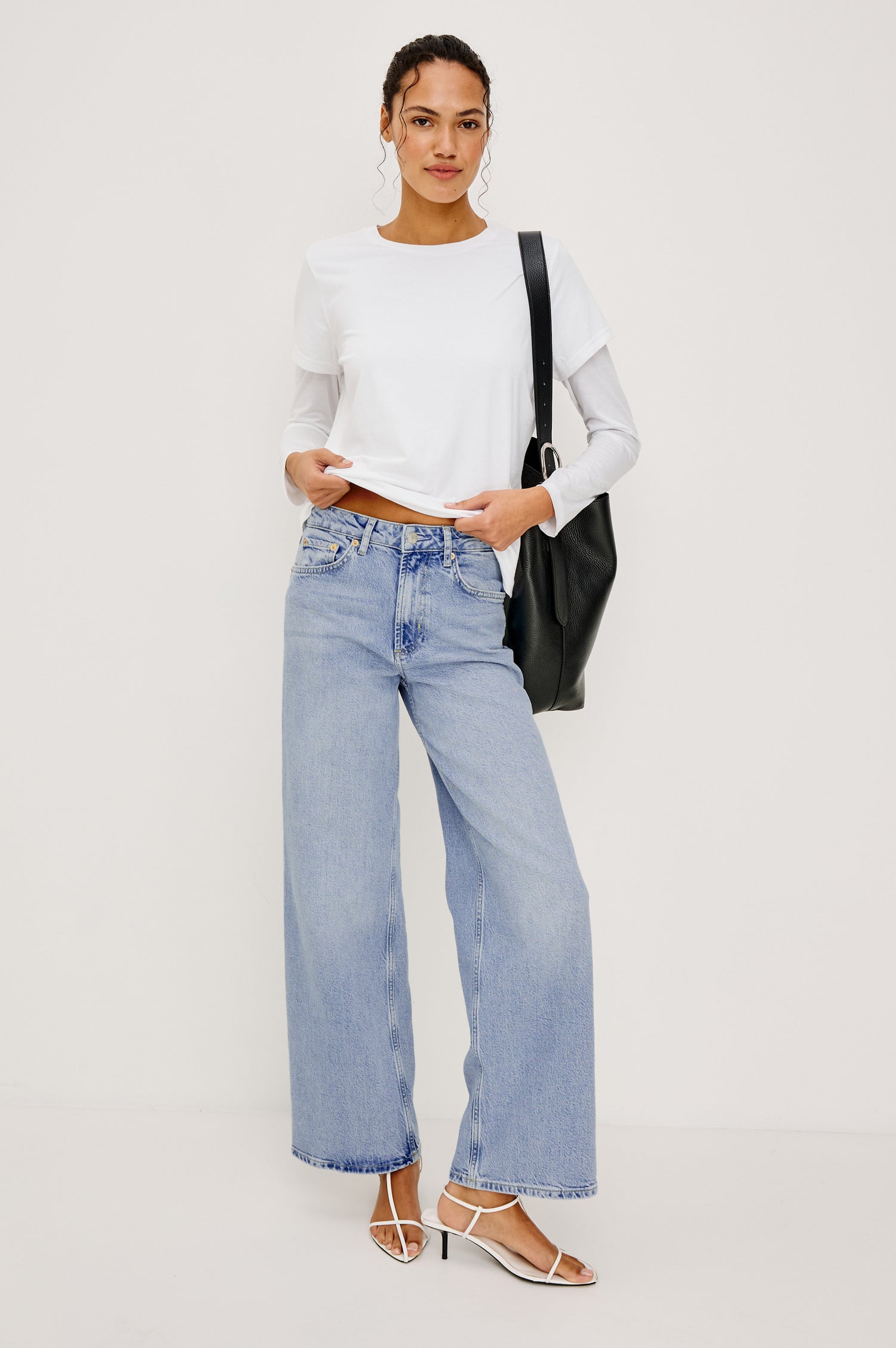 Getty Wide Leg Jean in Light Stretch Denim With High-Rise High-Waisted Fit, Button Fly, and 5-Pocket Styling in Jasper Colorway - Full Body Front View Featured on Model