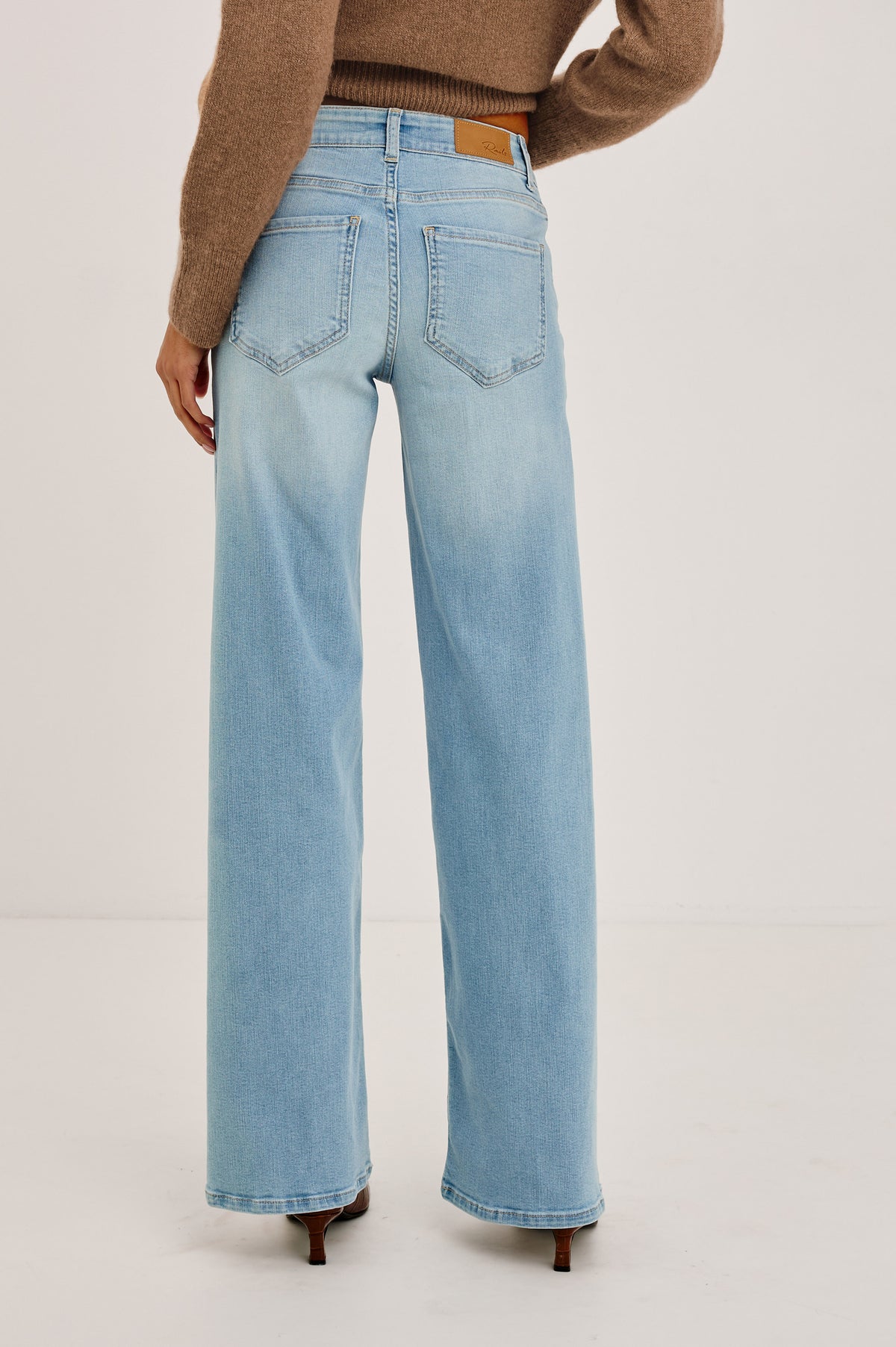 Getty Low Rise Wide Leg Jean in Comfort-stretch Denim With 5-Pockets in Wave Rider Colorway - Lower Body Back View Featured on Model