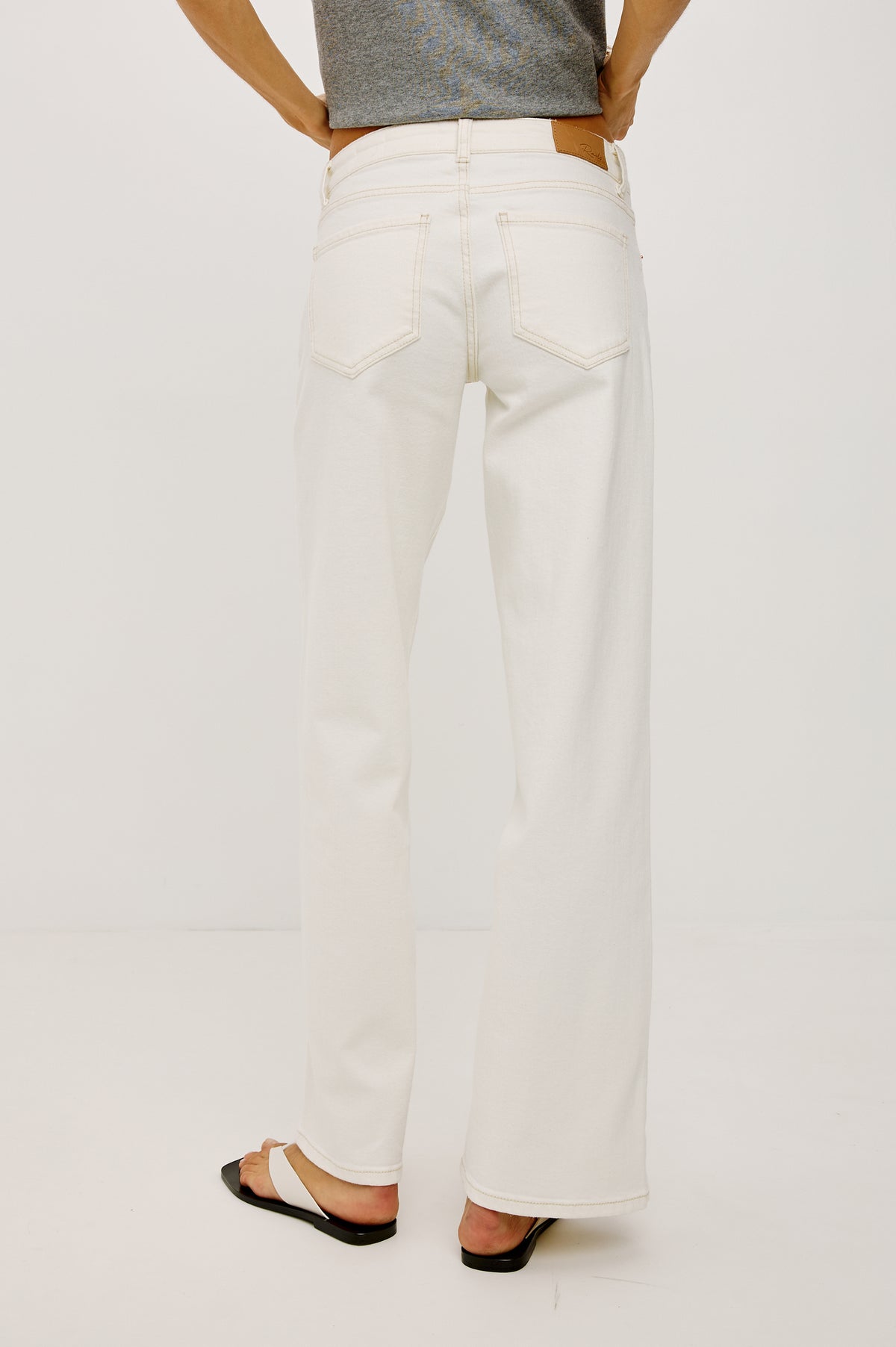 Getty Low Rise Wide Leg Jean in Comfort-stretch Denim With 5-Pockets in Vintage Ecru Colorway - Lower Body Back View Featured on Model