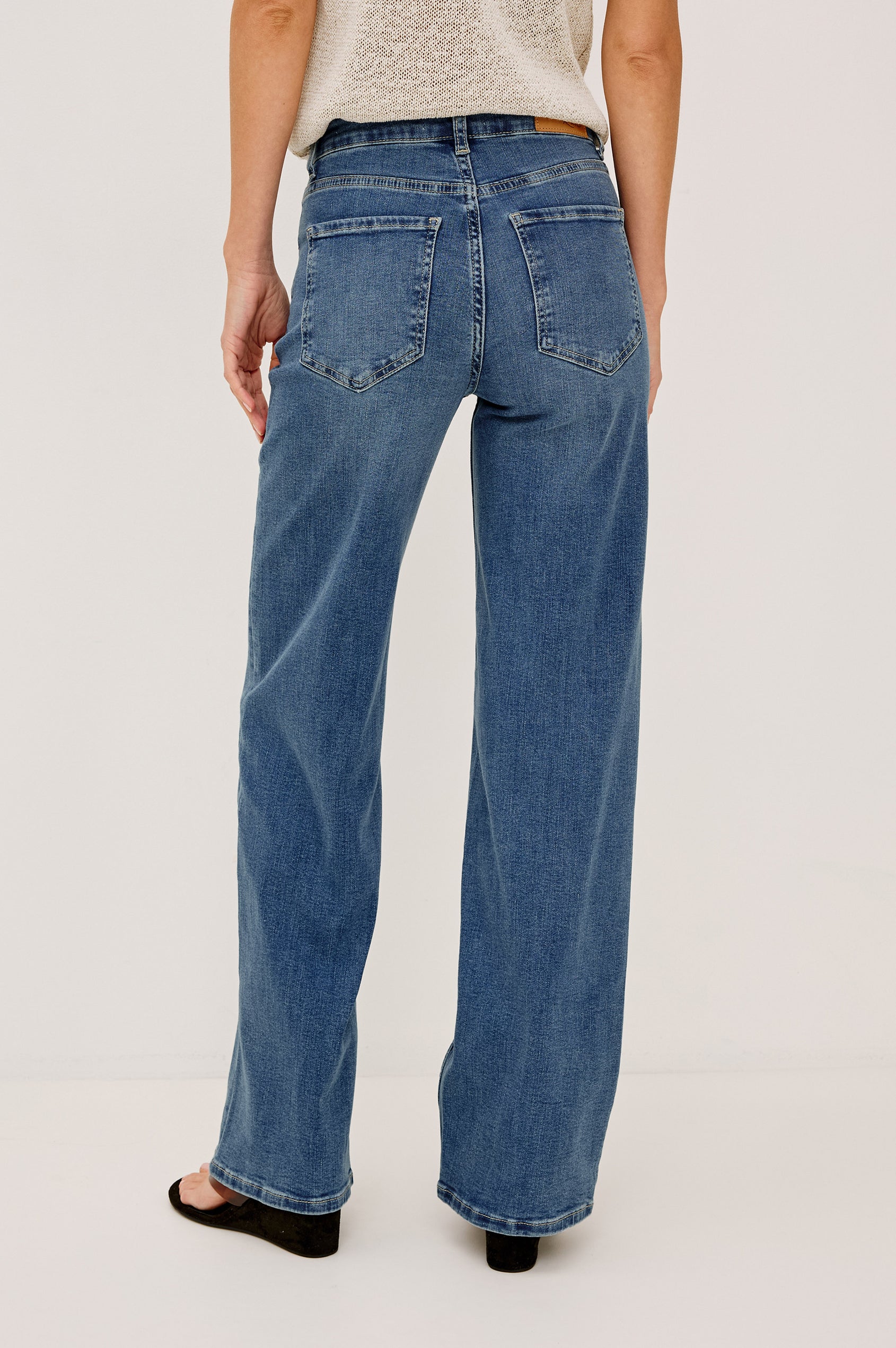 Getty Petite Wide Leg Denim Pants with Belt Loops, Two Front Pockets and Two Back Patch Pockets in East Coast Colorway - Front View Featured on Model