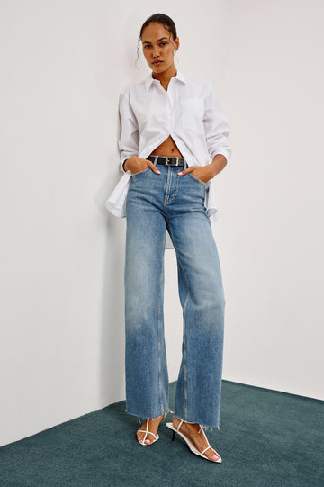 Getty full length 5-pocket wide leg jean in Tradewind colorway, a medium wash. Front full body view featured on model.