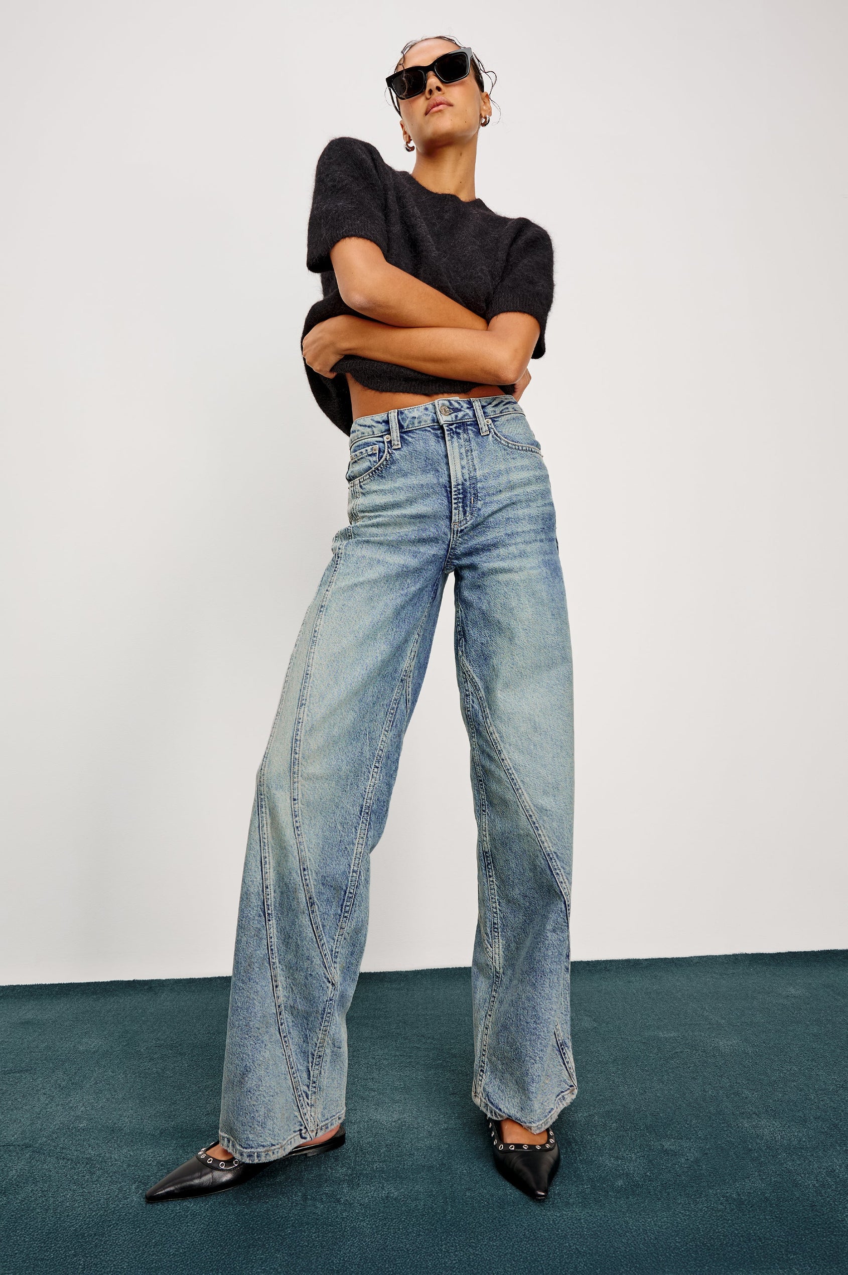Getty Twist Seam Wide Leg Denim Pants with a Diagonal Seam Across the Leg, Belt Loops, Two Front Pockets and Two Back Patch Pockets in Desert Sky Colorway - Full Body Front View Featured on Model