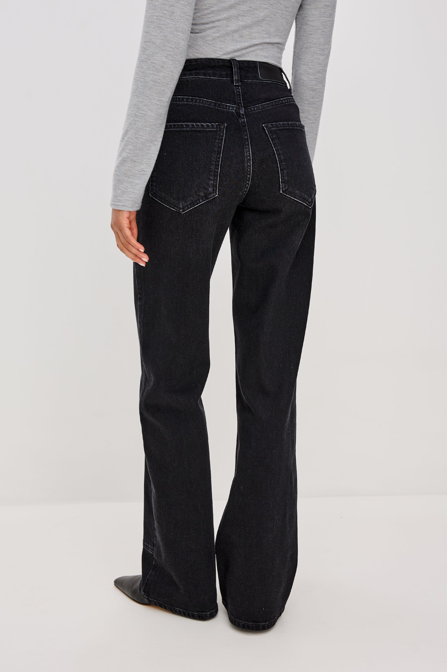 Getty Wide Leg Jean in Denim With High-Rise High-Waisted Fit, Front Button Fly, Carpenter Leg Panels, and 5-Pocket Styling in Onyx Colorway - Lower Body Back View Featured on Model