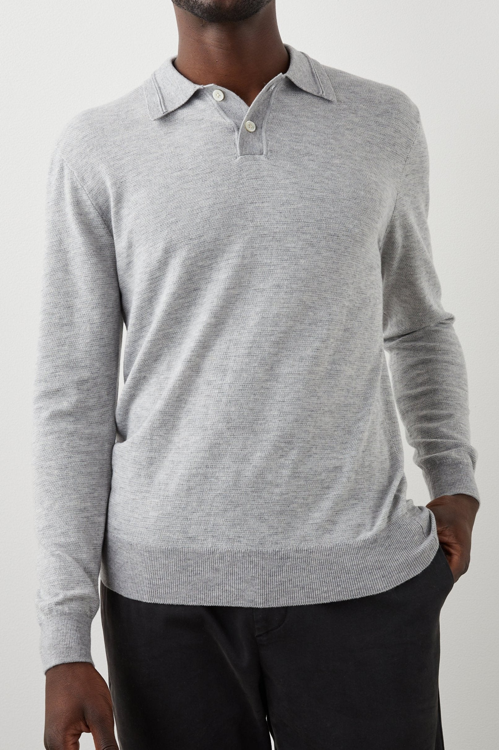 GREENWICH HEATHER GREY CREAM SWEATER - FRONT ONE HAND IN POCKET