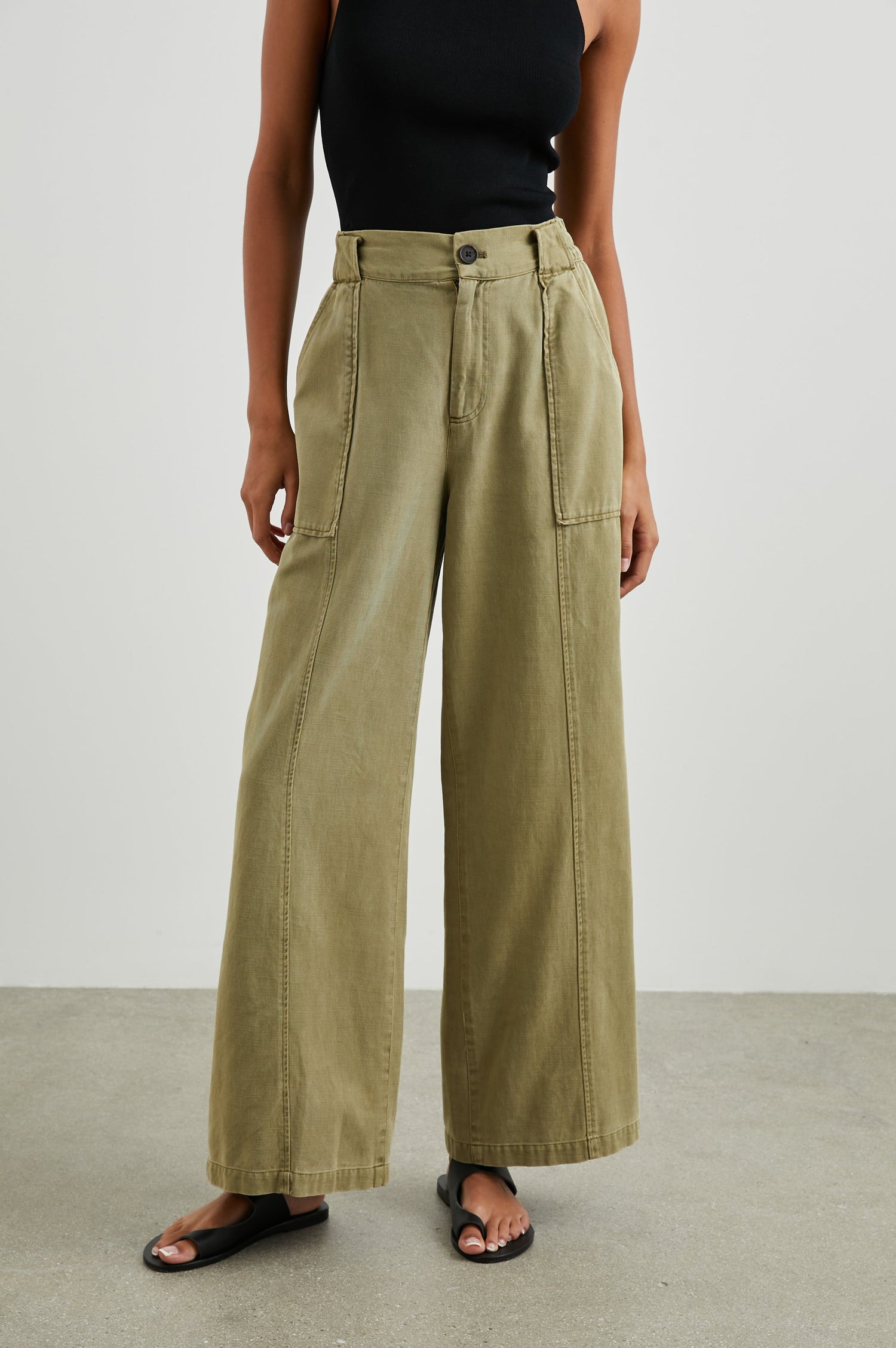 Greer Pants with Two Large Front Pockets, Two Back Welt Pockets and Vertical Seams Down the Front and Back Legs in Canteen Colorway - Front View Featured on Model 