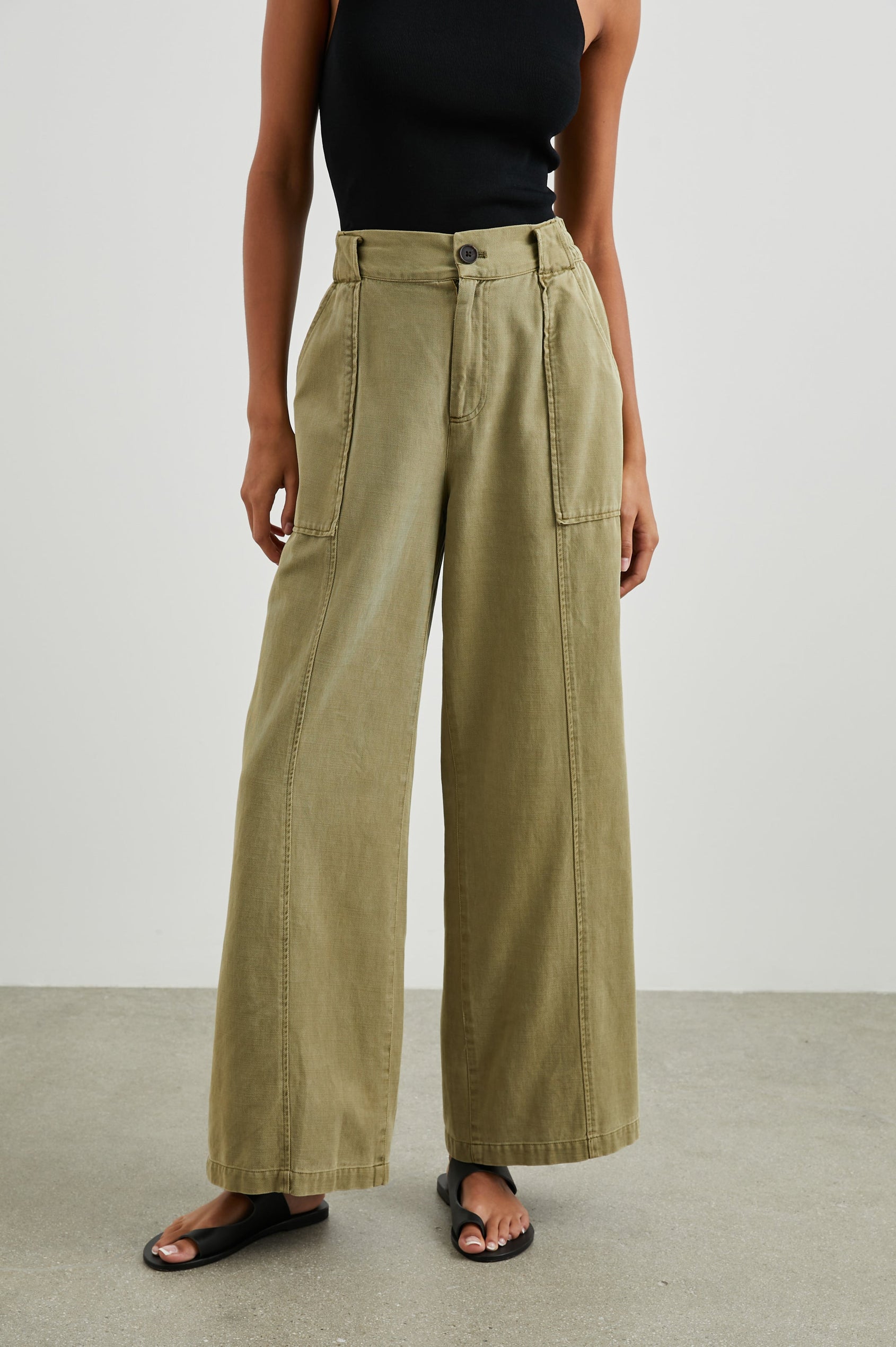 Greer Pants with Two Large Front Pockets, Two Back Welt Pockets and Vertical Seams Down the Front and Back Legs in Canteen Colorway - Front View Featured on Model 