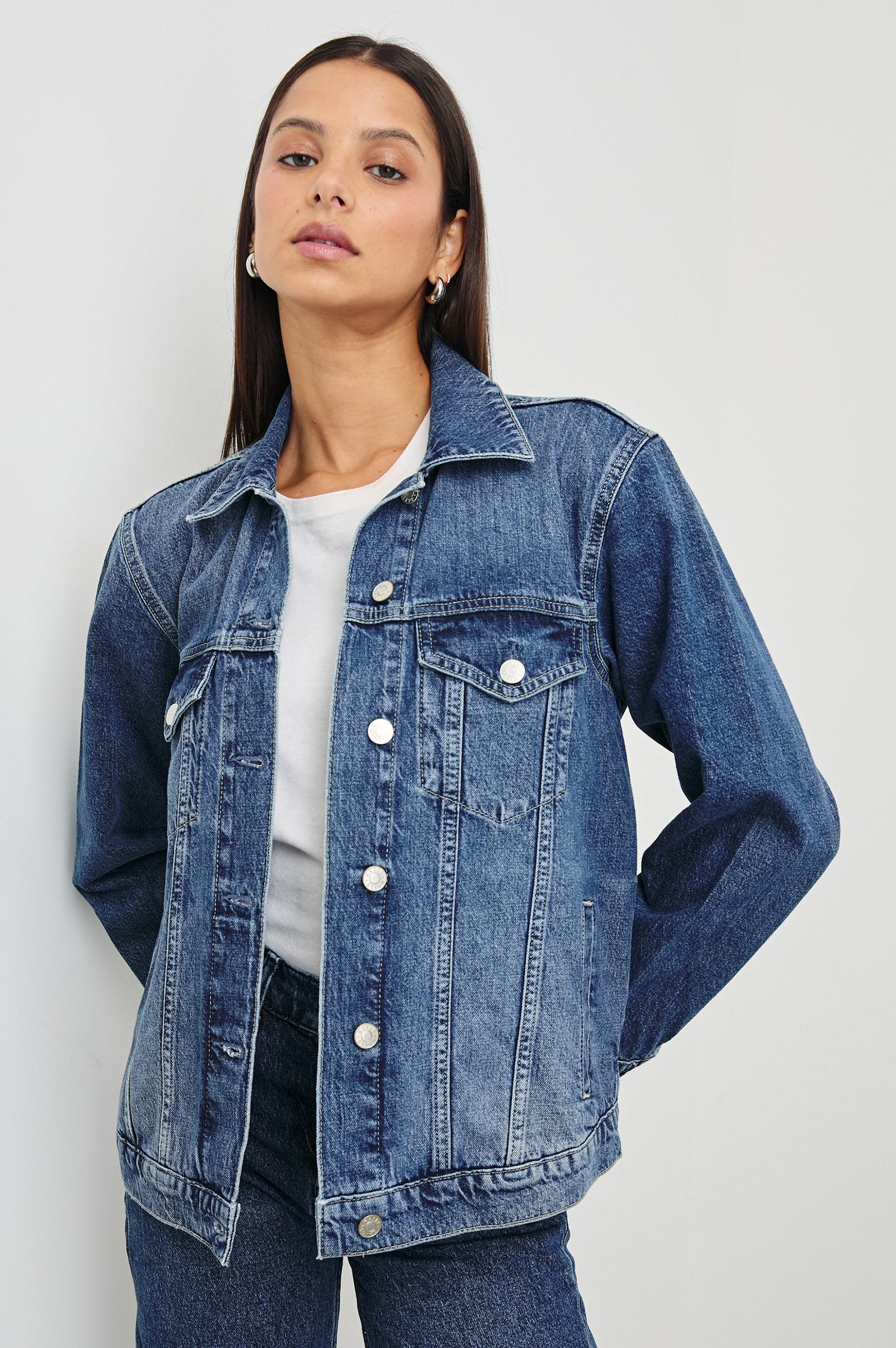 Grove Boyfriend Trucker Denim Jacket with Button Closure, Two Front Pockets, Two Chest Button Flap Pockets, Front Vertical Seams in Indigo Haze Colorway - Front View Featured on Model  