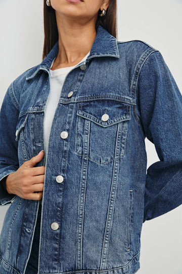 Grove Boyfriend Trucker Denim Jacket with Button Closure, Two Front Pockets, Two Chest Button Flap Pockets, Front Vertical Seams in Indigo Haze Colorway - Front View Featured on Model  