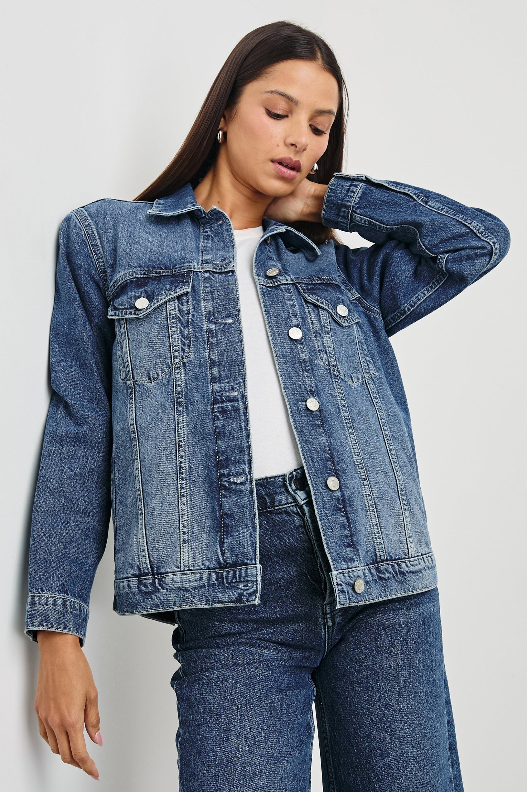 Grove Boyfriend Trucker Denim Jacket with Button Closure, Two Front Pockets, Two Chest Button Flap Pockets, Front Vertical Seams in Indigo Haze Colorway - Front View Featured on Model  