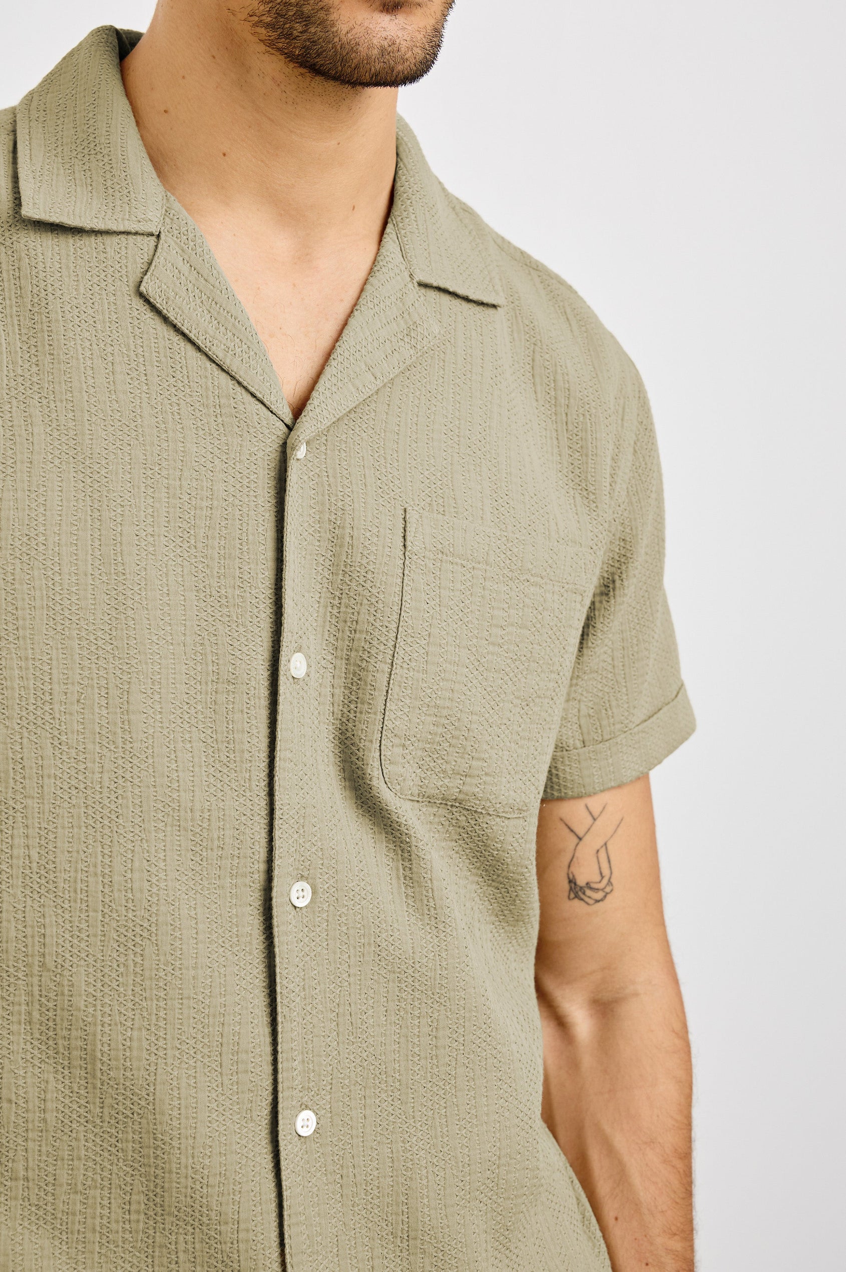 Haney Collared Button Front Shirt with Short Sleeves and a Chest Pocket in Kelp Colorway. Front View Shown on Model.