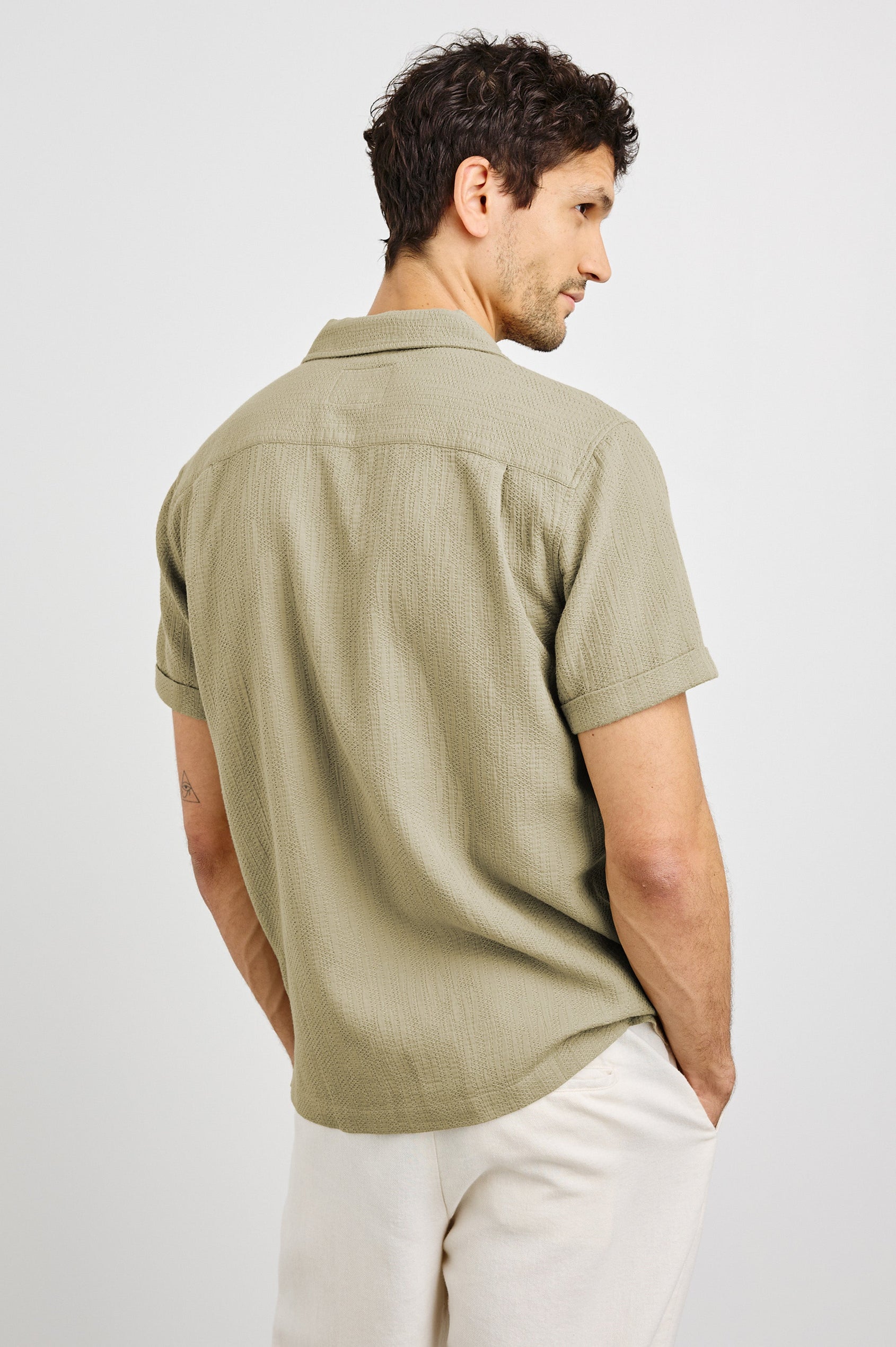 Haney Collared Button Front Shirt with Short Sleeves and a Chest Pocket in Kelp Colorway. Back View Shown on Model.