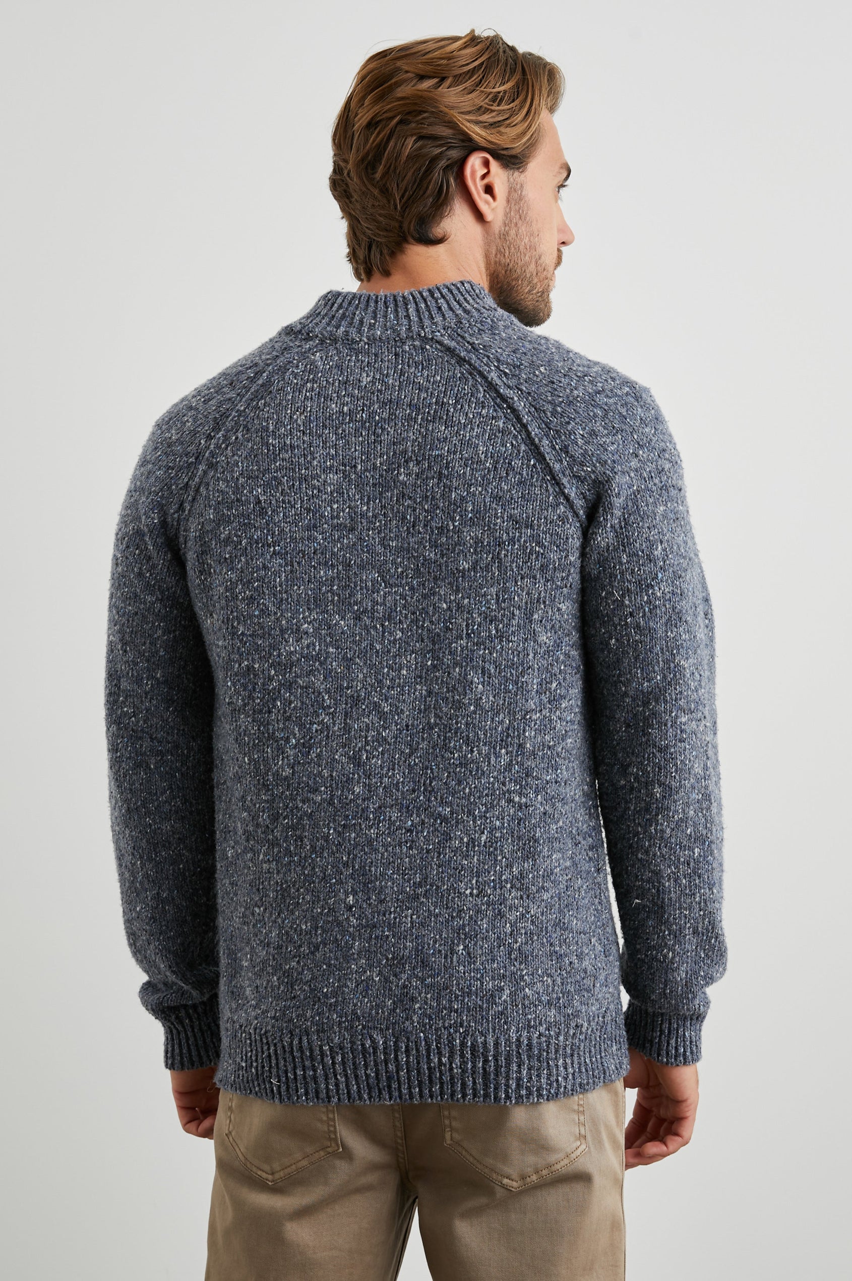 Harding Long-Sleeve Sweater with a Three-Button Half Placket, a Mock Neck and Ribbed Trim in Blue Nep Colorway, a Speckled Blue - Back View Featured on Model