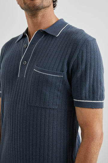 Hardy Short-Sleeve Ribbed Polo Shirt with a Chest Patch Pocket and a Three-Button Placket in Faded Navy Colorway, with White Trim - Front View Featured on Model 