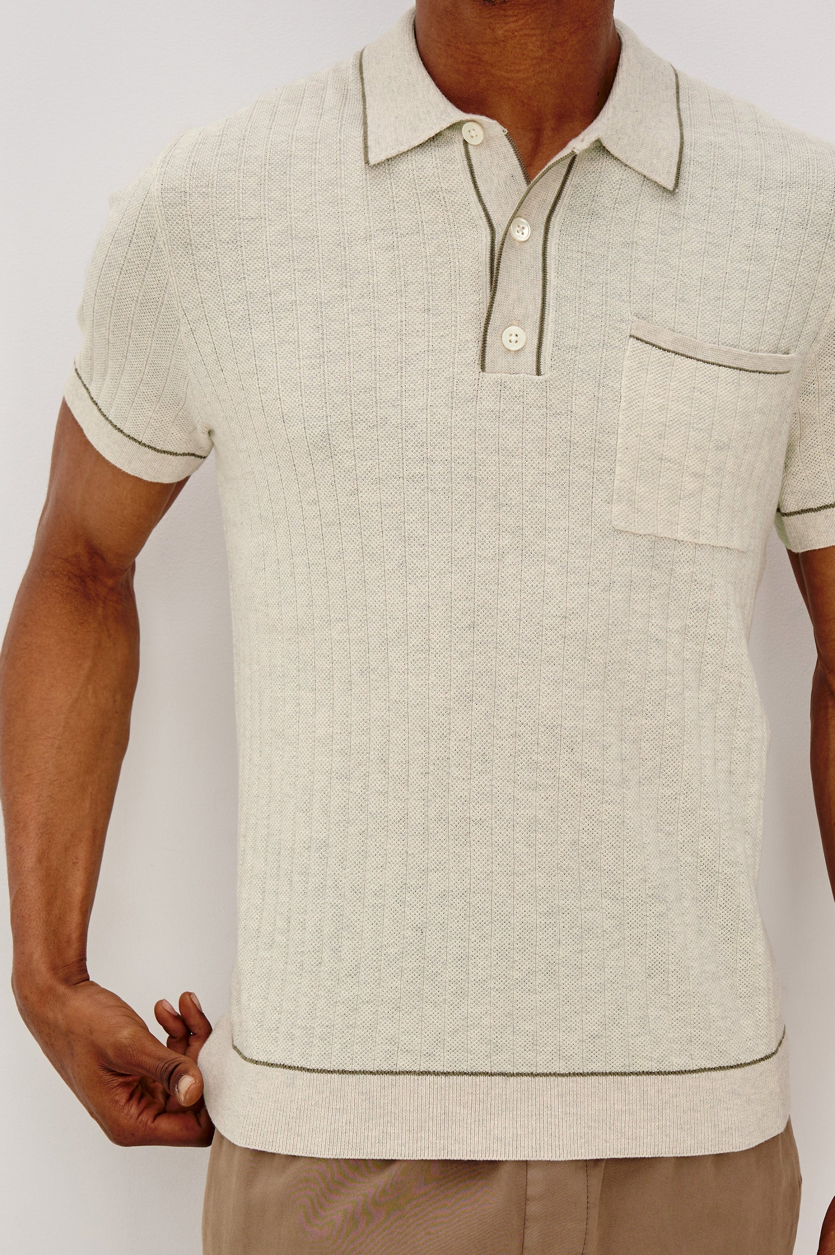Hardy short sleeve cotton rib polo with chest pocket, two button placket and contrast stitching in Oat Heather - front detail view on model